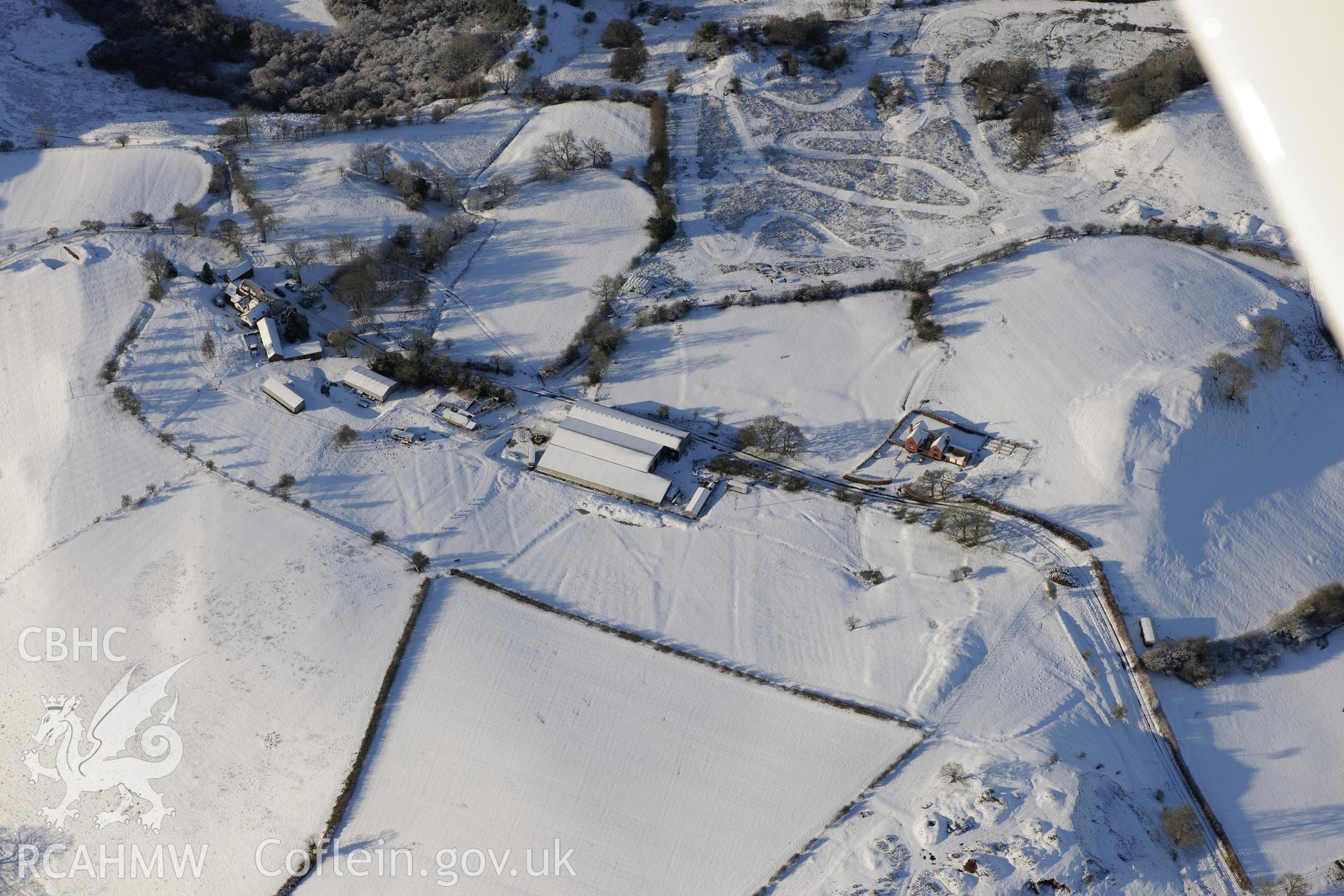 Earthworks of a longhouse and Cefnllys Castle deer park, Penybont, north east of Llandrindod Wells. Oblique aerial photograph taken during the Royal Commission?s programme of archaeological aerial reconnaissance by Toby Driver on 15th January 2013.