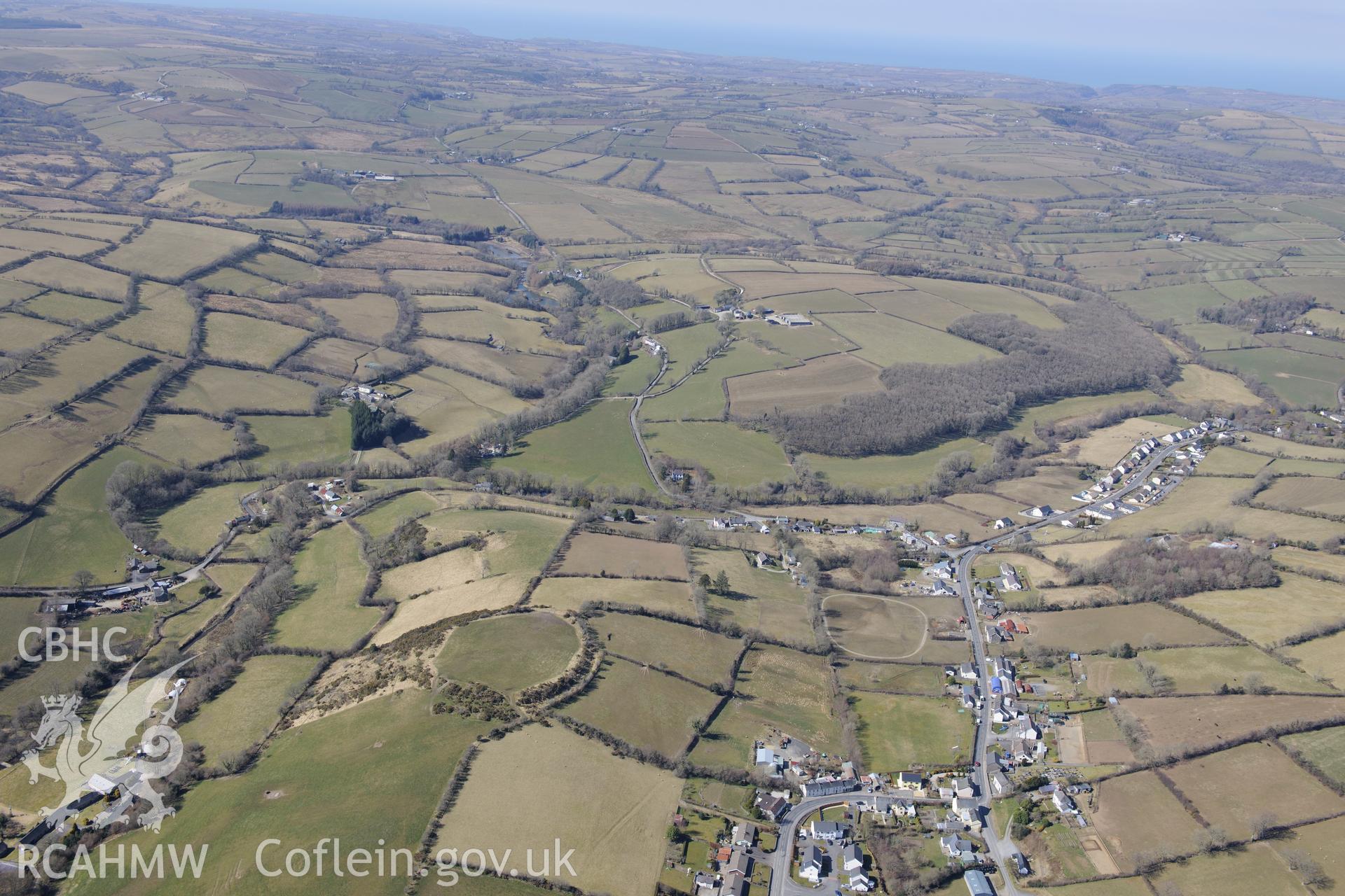 The village of Cribyn and Gaer Maesmynach hillfort, north west of Lampeter. Oblique aerial photograph taken during the Royal Commission's programme of archaeological aerial reconnaissance by Toby Driver on 2nd April 2013.