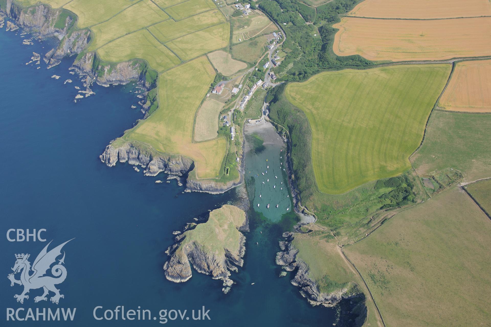 Abercastle, with anchorage, landing place, and Ynys-y-Castell promontory fort. Oblique aerial photograph taken during the Royal Commission?s programme of archaeological aerial reconnaissance by Toby Driver on 16th July 2013.