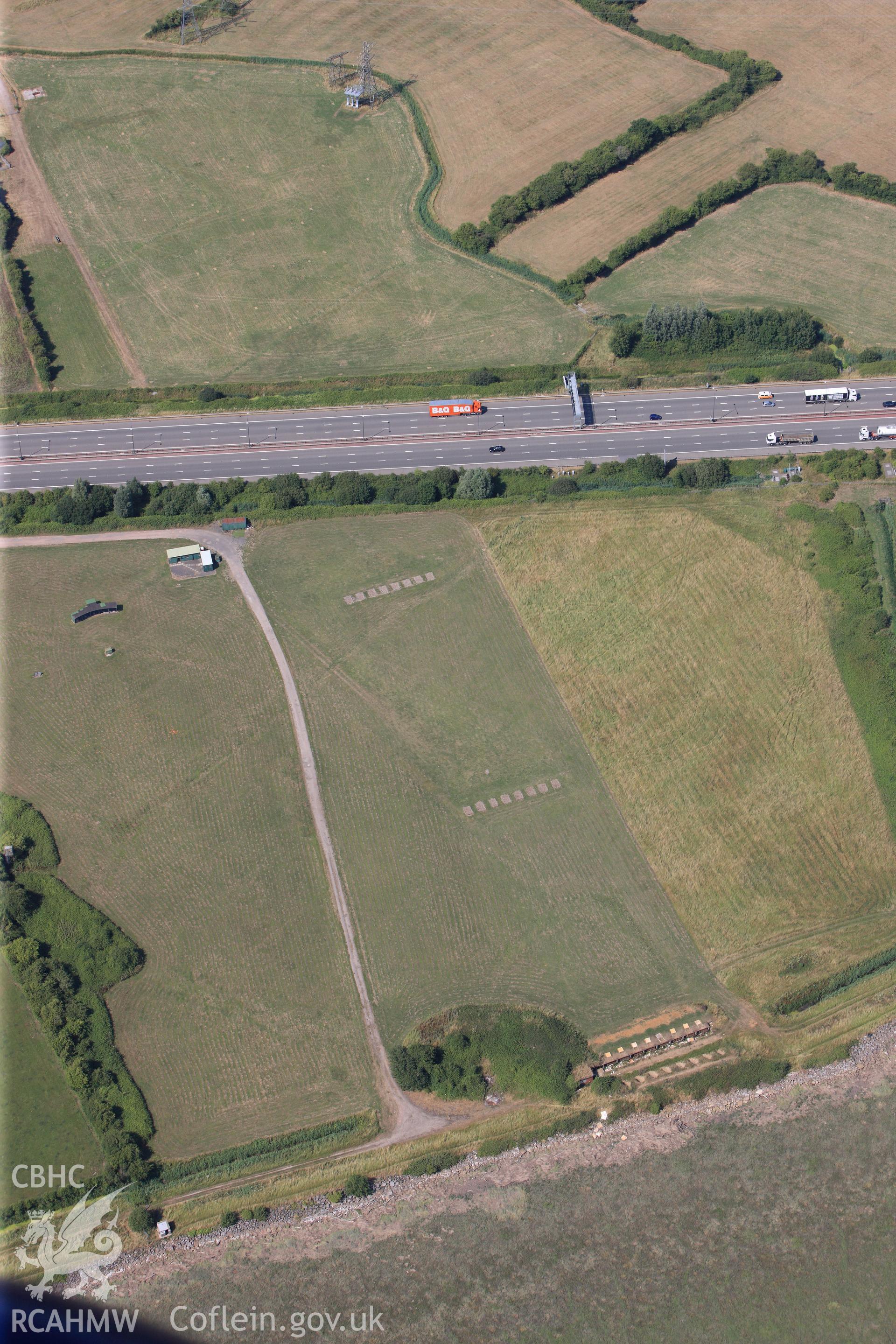 Caldicot & Rogiet rifle ranges, & section of M4 motorway running past southern edge of Caldicot on its way to 2nd Severn Crossing. Oblique aerial photograph taken during RCAHMW?s programme of archaeological aerial reconnaissance by Toby Driver, 01/08/2013.