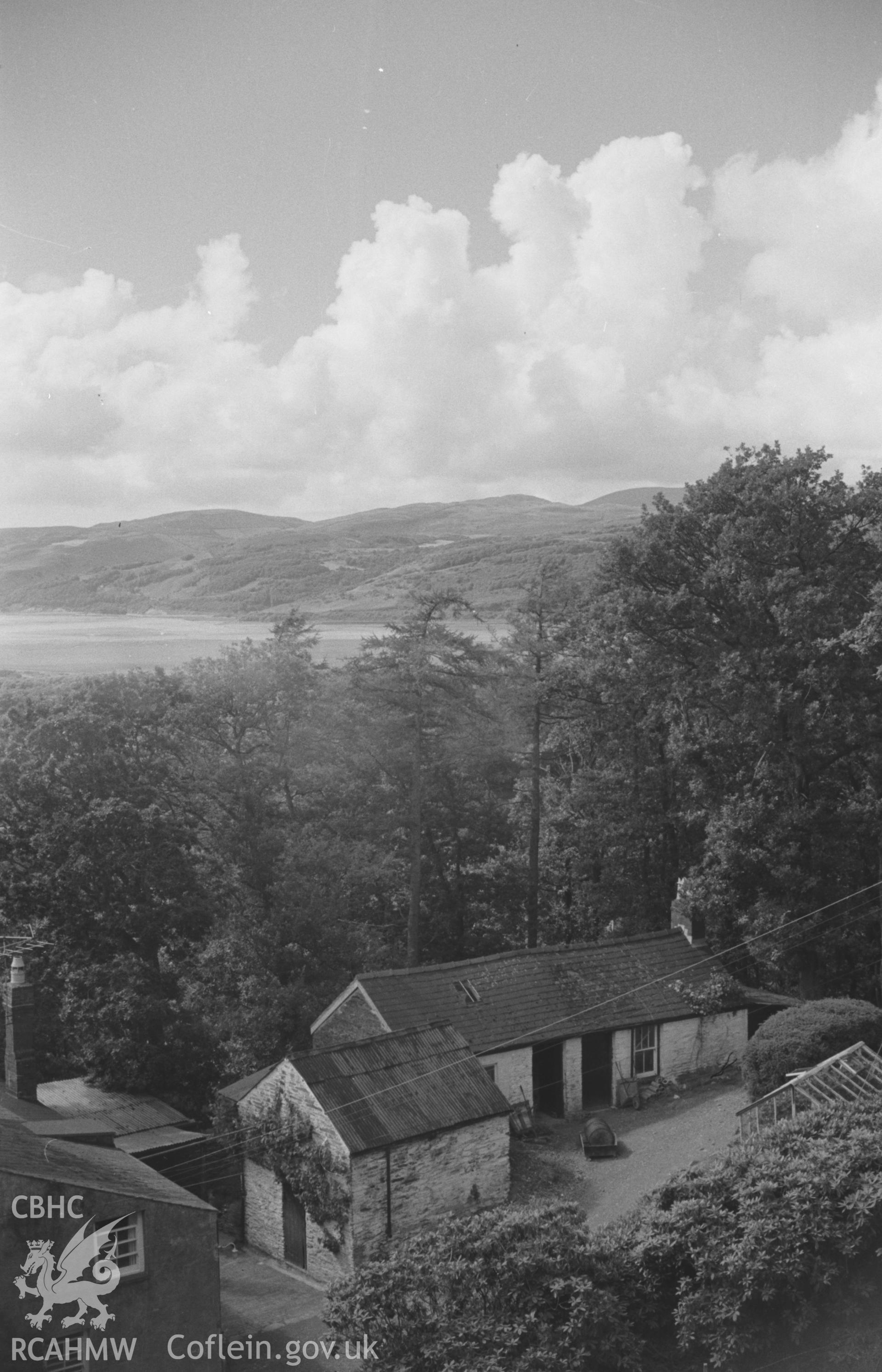 Digital copy of a black and white negative showing view to the Dyfi estuary over the outbuildings at Cymerau farm, Eglwysfach, near Machynlleth. Photographed by Arthur O. Chater in August 1965 looking west from Grid Reference SN 6952 9630.