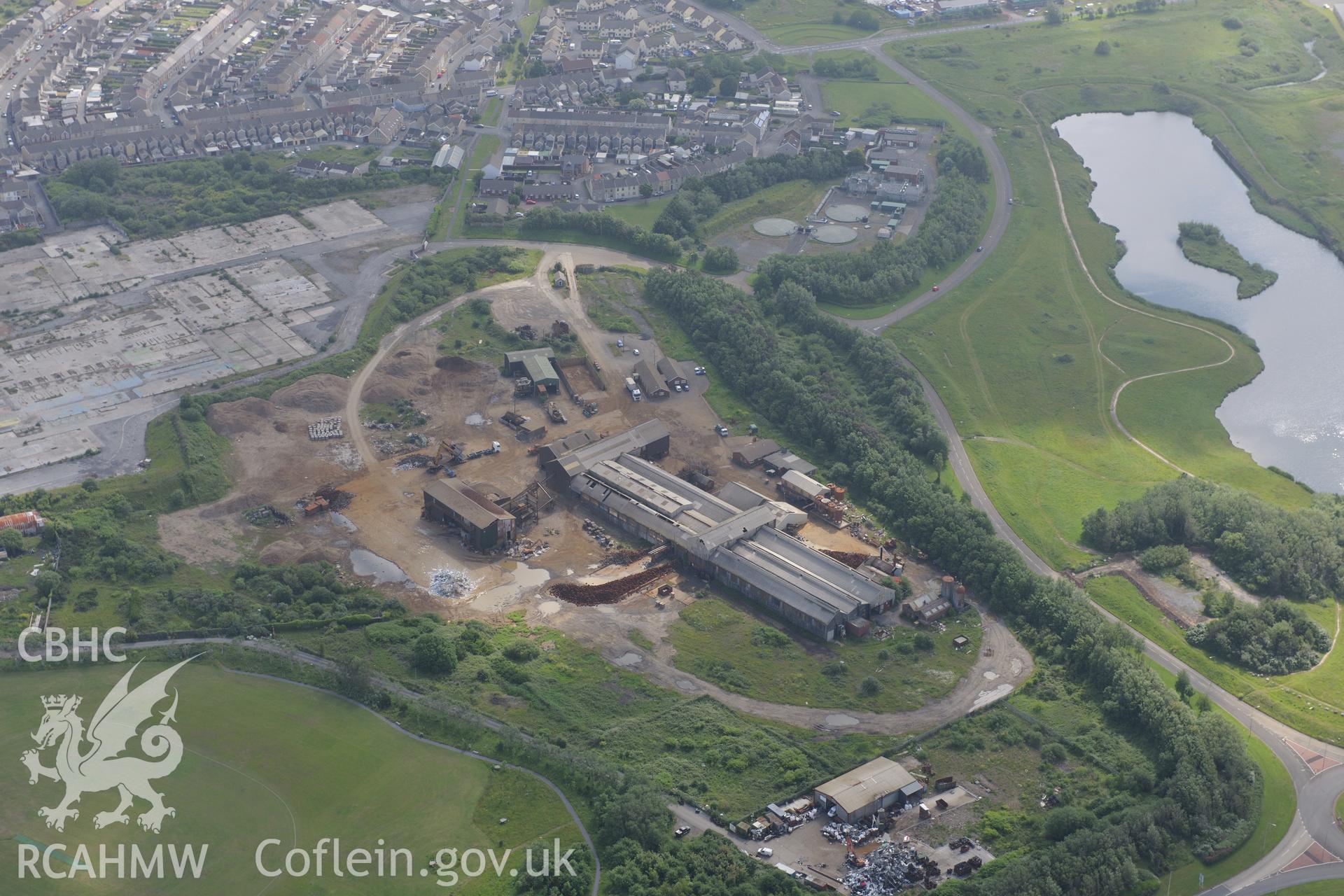 Site of the former copperworks dock; tinhouse and wern Canal. Now the site of an AMG scrap processing facility, Llanelli. Oblique aerial photograph taken during the Royal Commission's programme of archaeological aerial reconnaissance by Toby Driver on 19th June 2015.