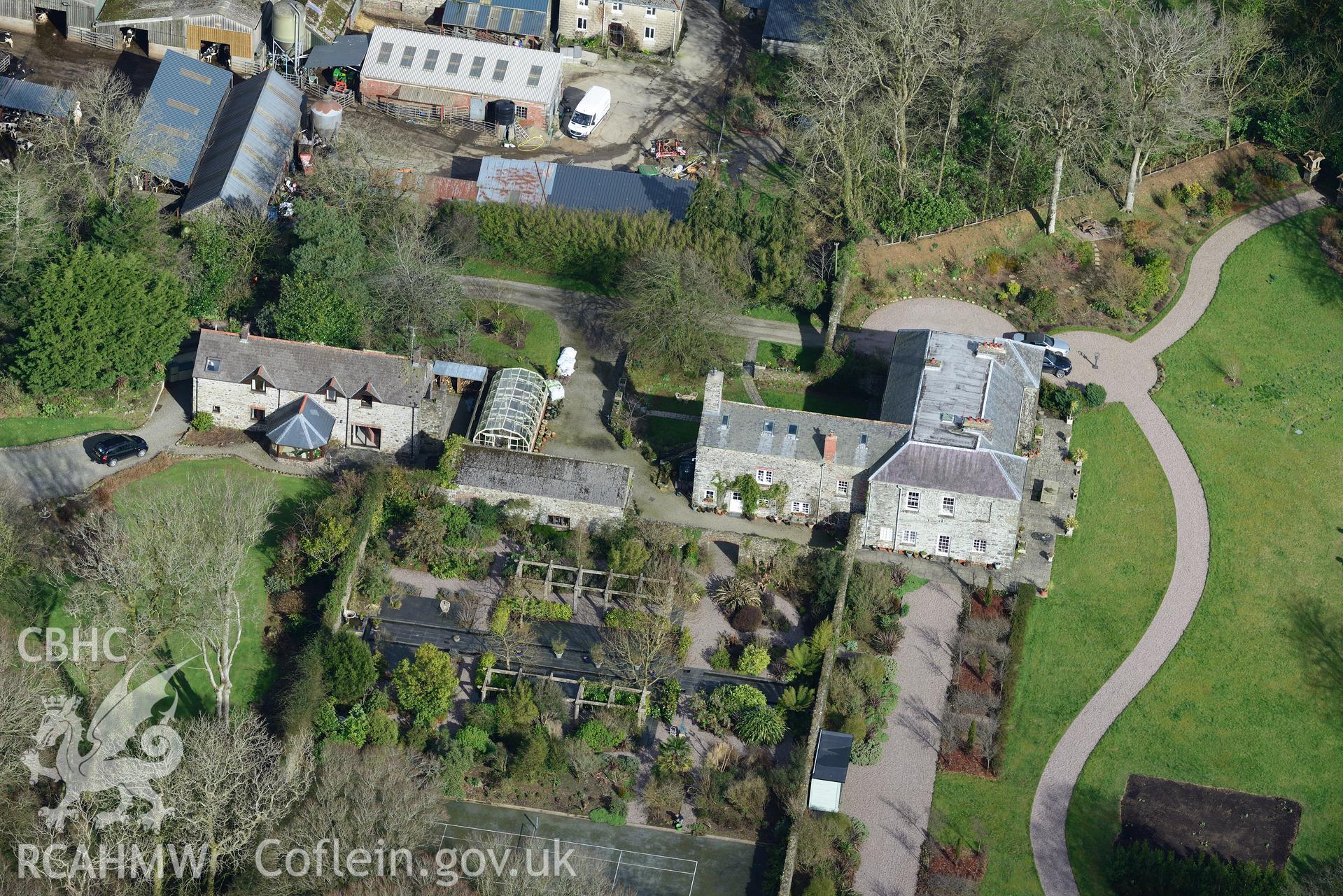 Tregarn Hall and the associated garden and coach house. Oblique aerial photograph taken during the Royal Commission's programme of archaeological aerial reconnaissance by Toby Driver on 13th March 2015.