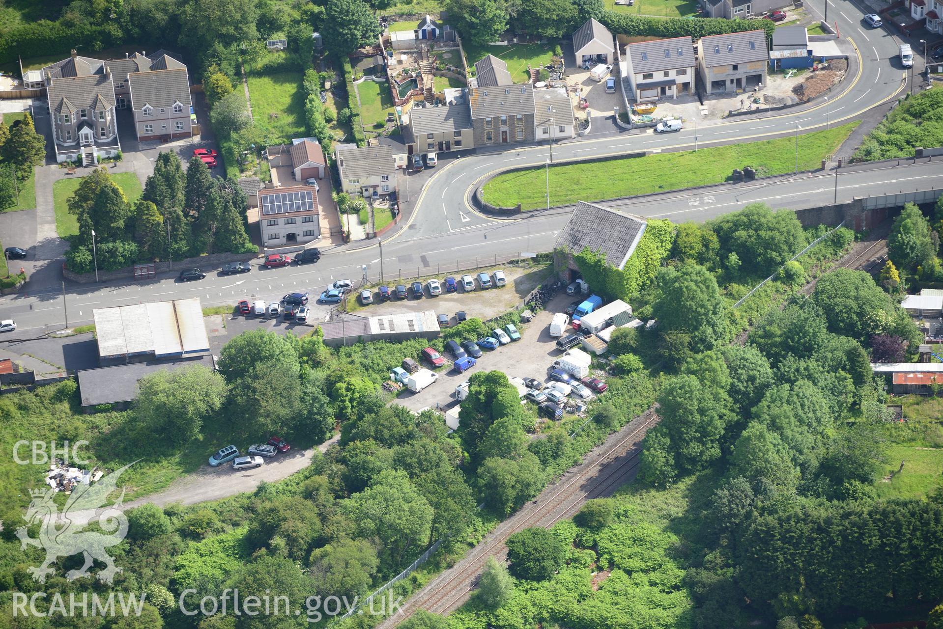 Glynea Pit engine house and the village of Bynea, Llanelli. Oblique aerial photograph taken during the Royal Commission's programme of archaeological aerial reconnaissance by Toby Driver on 19th June 2015.