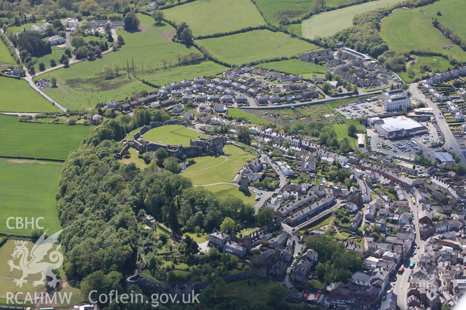 Denbigh Castle, St. David's or St. Leicester's Church, Coed Cwningaer, Castle House and the Goblin Tower, Denbigh. Oblique aerial photograph taken during Royal Commission?s programme of archaeological aerial reconnaissance by Toby Driver, 22nd May 2013.