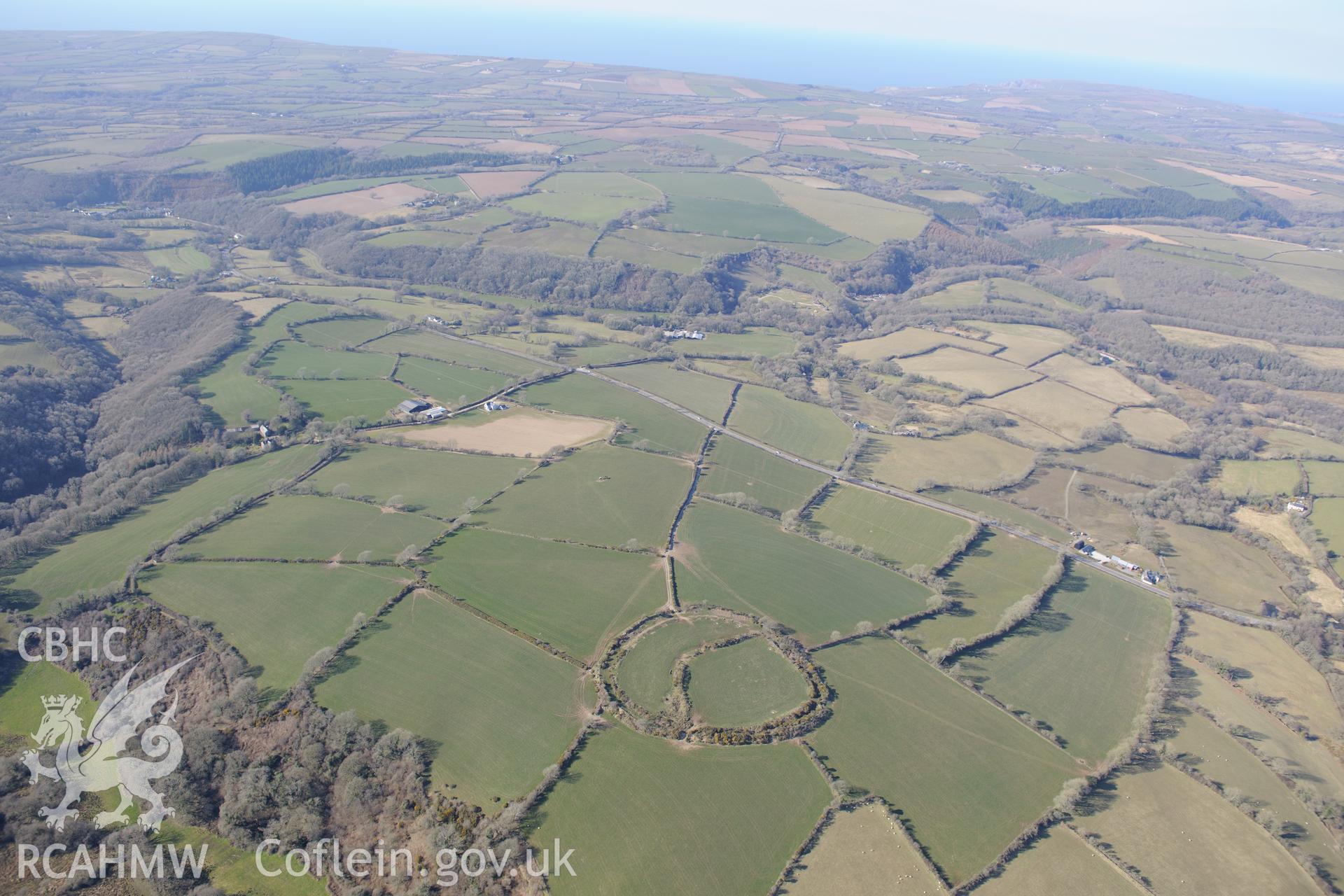 Castell Mawr henge or hillfort, Eglwyswrw, south west of Cardigan. Oblique aerial photograph taken during the Royal Commission's programme of archaeological aerial reconnaissance by Toby Driver on 2nd April 2013.