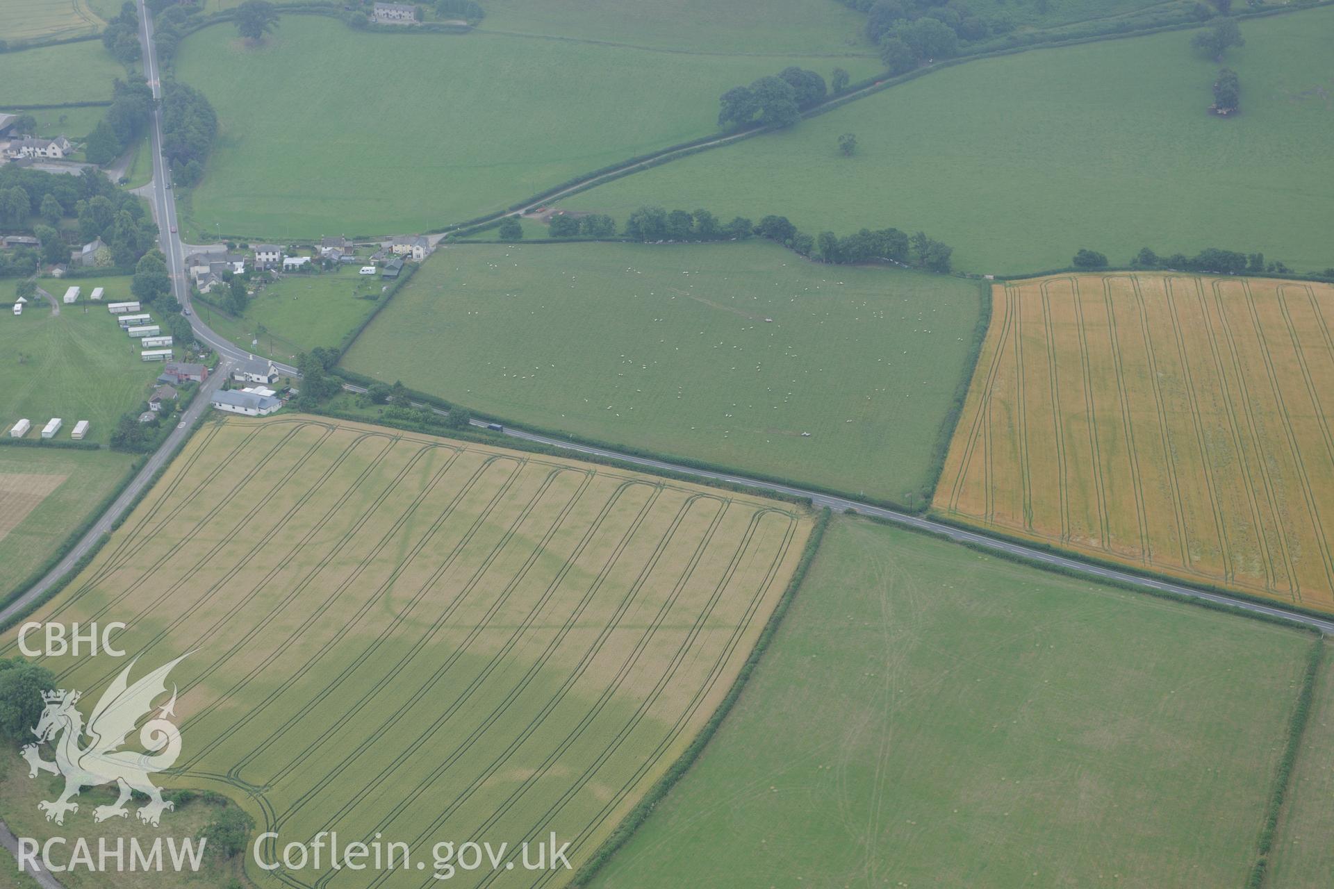 Walton palisaded enclosure and Roman camp, east of Llandrindod Wells, near the Wales-England border. Oblique aerial photograph taken during the Royal Commission?s programme of archaeological aerial reconnaissance by Toby Driver on 1st August 2013.