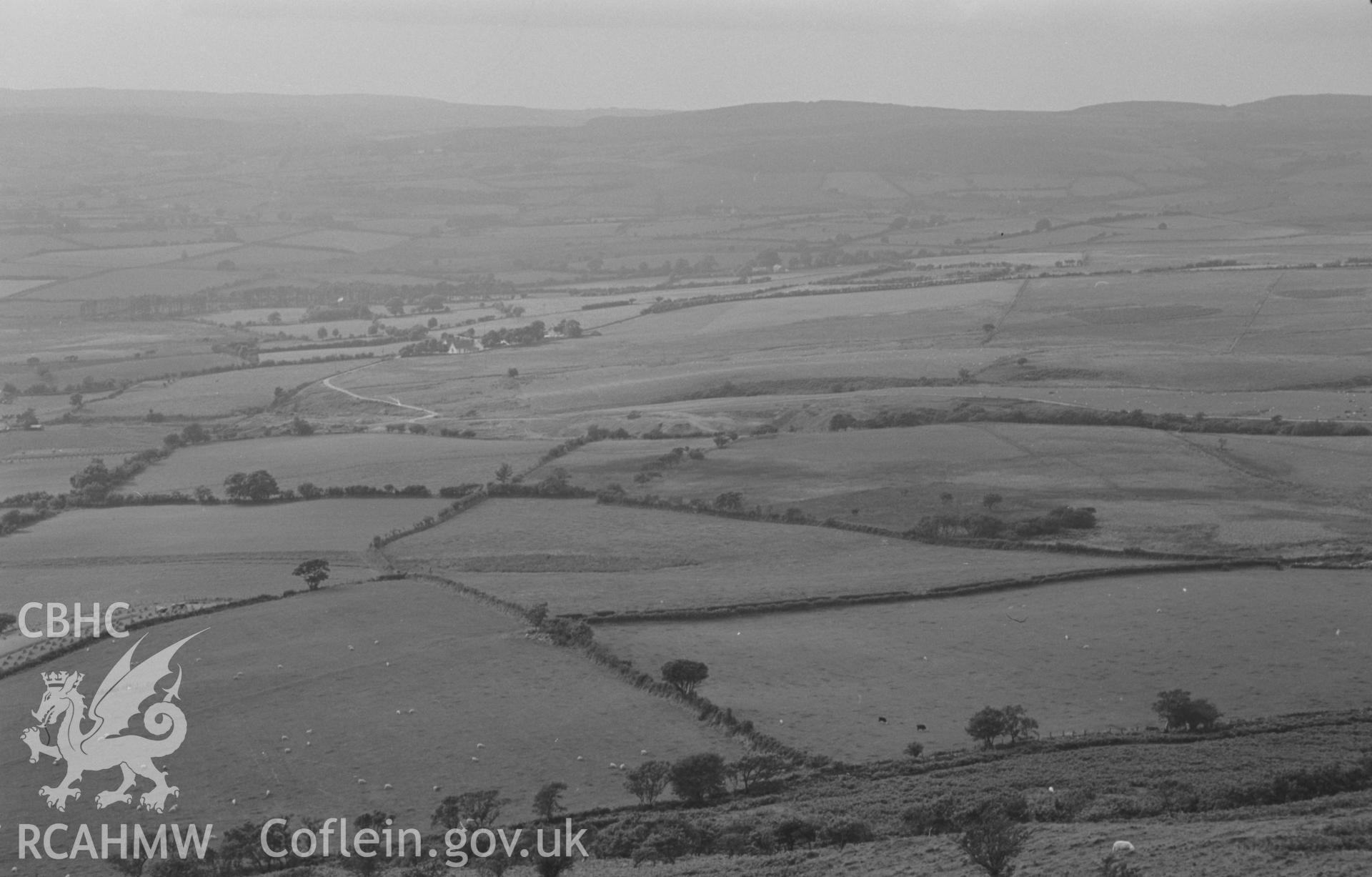 Digital copy of a black and white negative showing Cwm Mawr lead mine from Pen y Bannau hill fort, Pontrhydfendigaid. Photographed by Arthur O. Chater on 25th August 1967 looking west north west from Grid Reference SN 742 669.