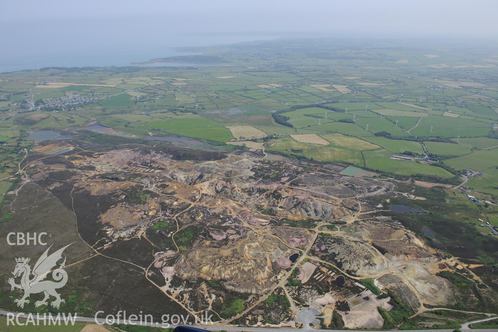 Parys Mountain copper mines, Amlwch, Anglesey. Oblique aerial photograph taken during the Royal Commission?s programme of archaeological aerial reconnaissance by Toby Driver on 12th July 2013.