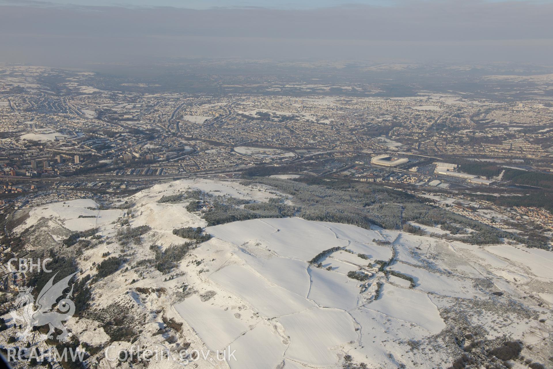 Kilvey Hill, Llanerch Slant disused coal pit and the Liberty Stadium, Swansea. Oblique aerial photograph taken during the Royal Commission?s programme of archaeological aerial reconnaissance by Toby Driver on 24th January 2013.