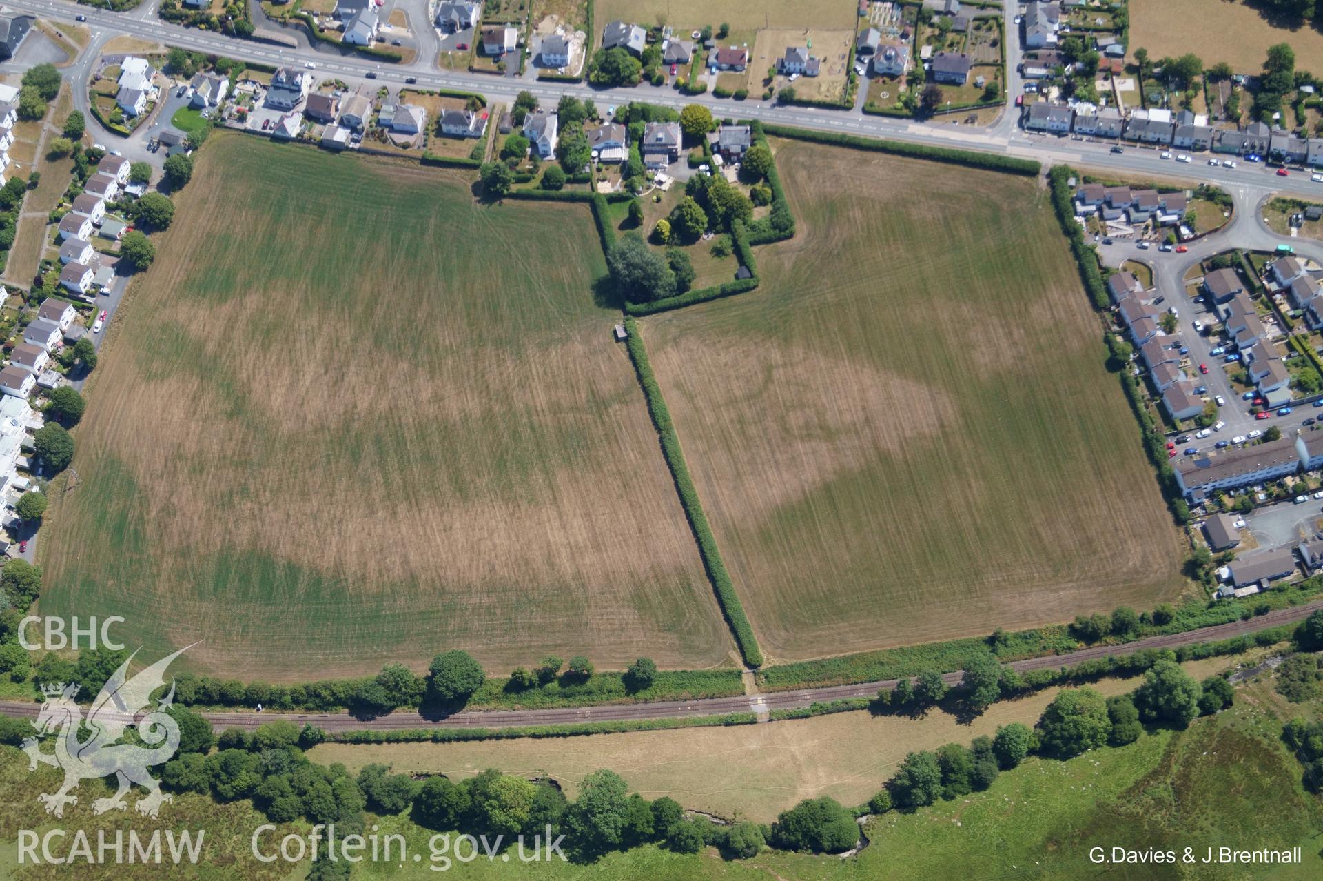 Aerial photograph showing 'cluster of indistinct circles and squares across two fields. Possible barrows,' on the western edge of Bow Street, Aberystwyth. Photographed by Glyn Davies and Jonathan Brentnall on 22nd July 2018 under drought conditions.