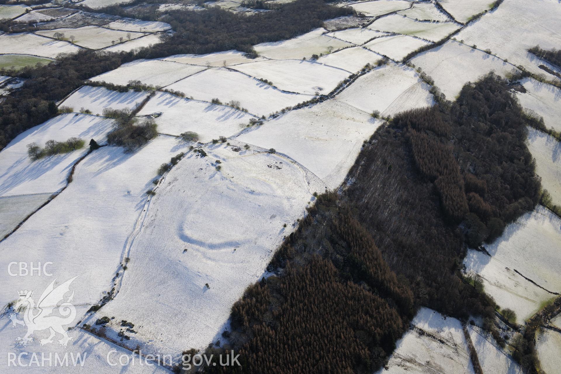 Twyn-y-Gaer enclosure, Defynnog, south east of Sennybridge. Oblique aerial photograph taken during the Royal Commission?s programme of archaeological aerial reconnaissance by Toby Driver on 15th January 2013.