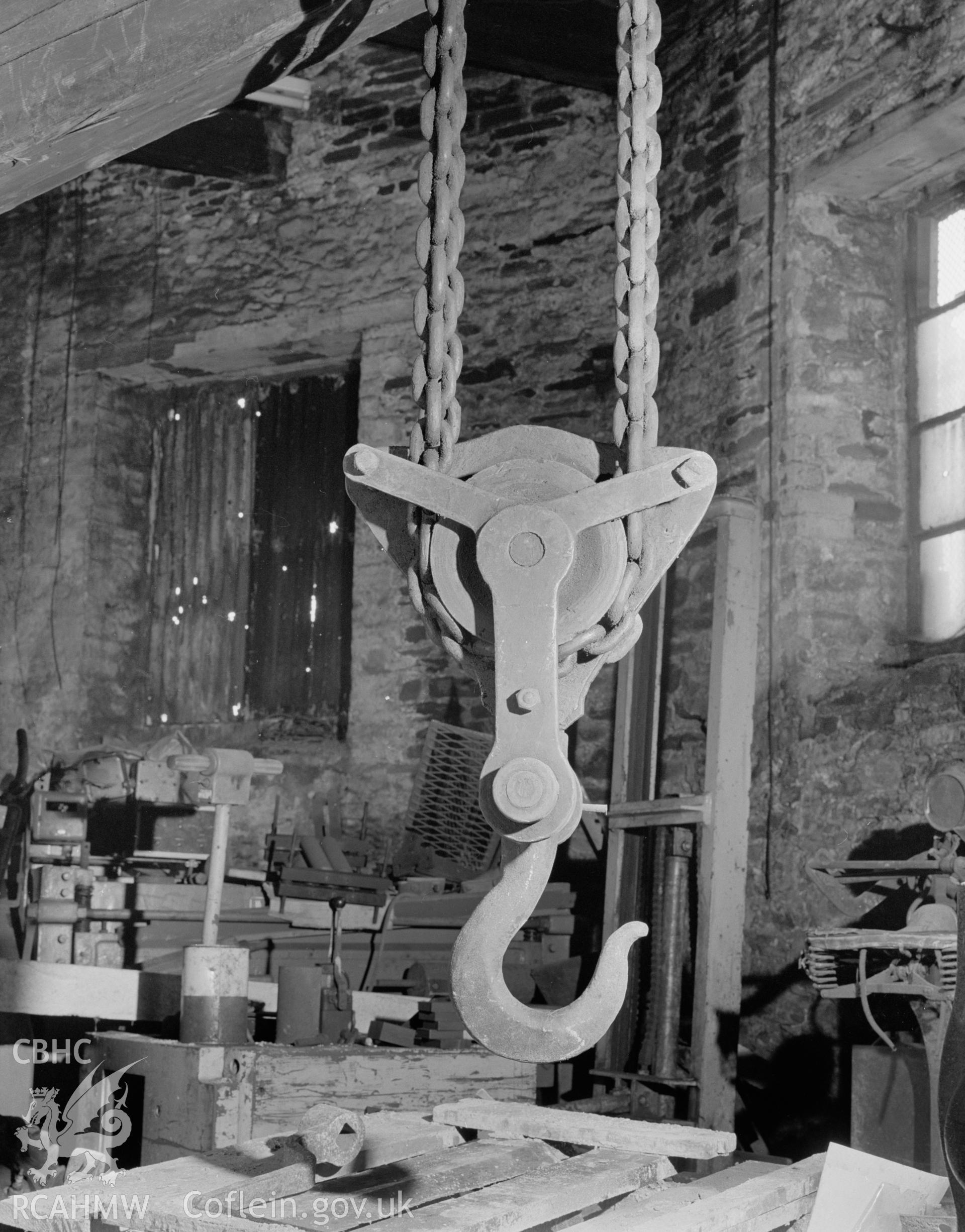 Digital copy of a black and white negative showing detail of the crane at Player's Works Foundry, Clydach, taken by RCAHMW, undated.