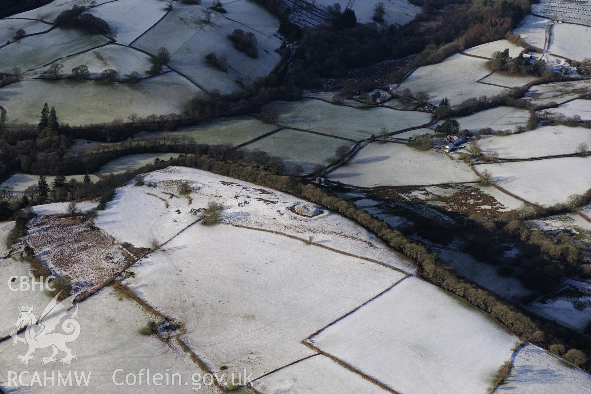 Fforest Castle and a house platform at Twdin Motte, north of Beulah, west of Builth Wells. Oblique aerial photograph taken during the Royal Commission?s programme of archaeological aerial reconnaissance by Toby Driver on 15th January 2013.