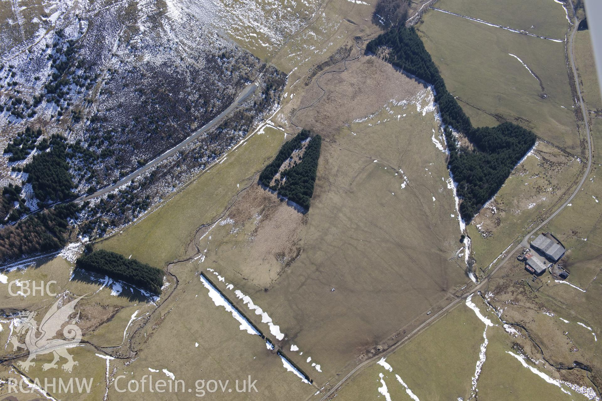 Llys Arthur defended enclosure, north east of Ponterwyd. Oblique aerial photograph taken during the Royal Commission's programme of archaeological aerial reconnaissance by Toby Driver on 2nd April 2013.