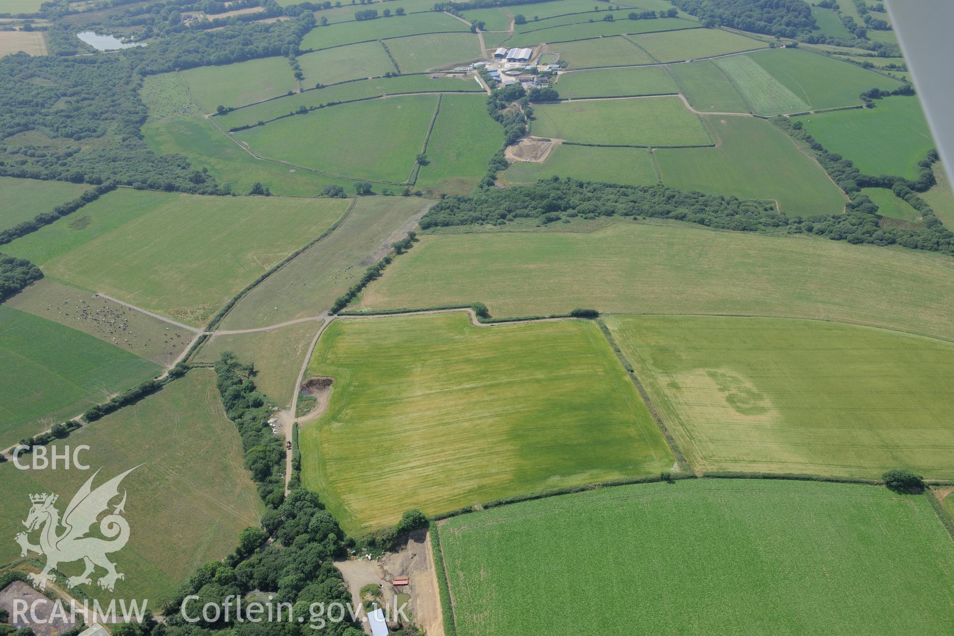 Roman Road of Carmarthen - possible features at Cotland. Oblique aerial photograph taken during the Royal Commission?s programme of archaeological aerial reconnaissance by Toby Driver on 16th July 2013.