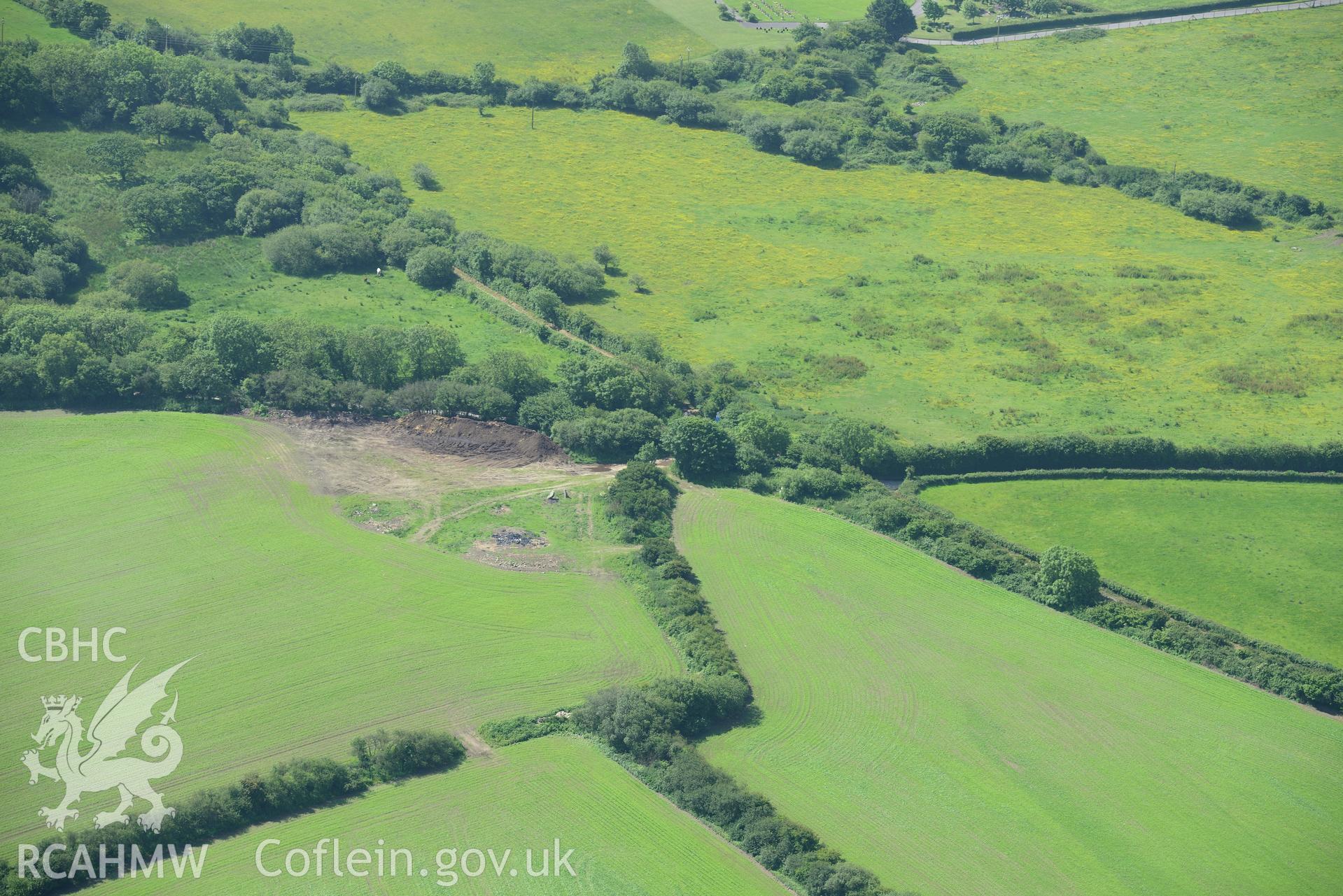 Possible site of St. Cewydd Church, Llangewydd Settlement and the original location of the Laleston Headstone. Oblique aerial photograph taken during the Royal Commission's programme of archaeological aerial reconnaissance by Toby Driver on 19th June 2015.