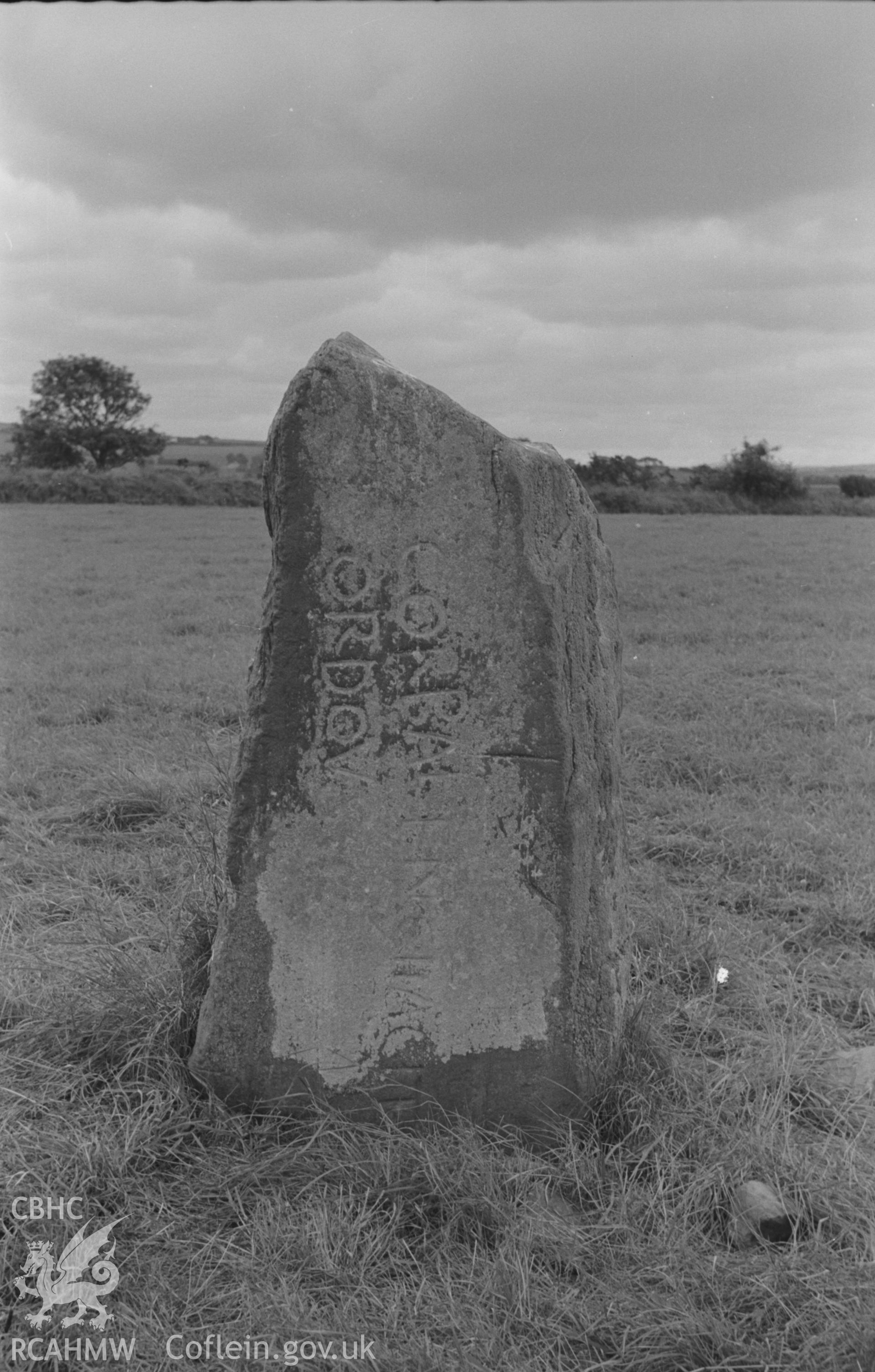 Digital copy of a black and white negative showing the Corbalengi stone. Photographed in August 1963 by Arthur O. Chater from Grid Reference SN 2891 5137, looking south west.