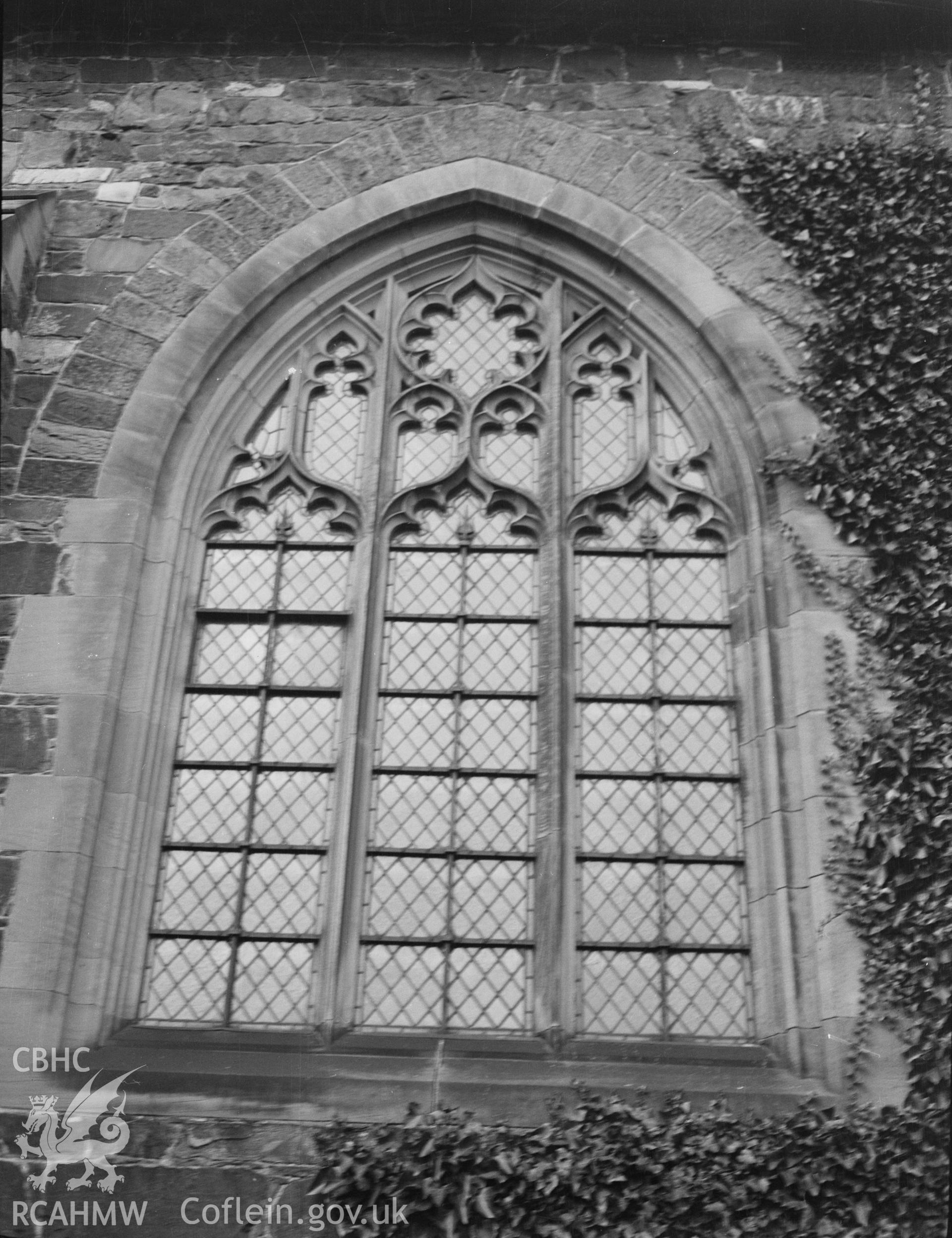 Digital copy of a nitrate negative showing exterior view of the south chancel window, St Idloes' Church, Llanidloes. From the National Building Record Postcard Collection.