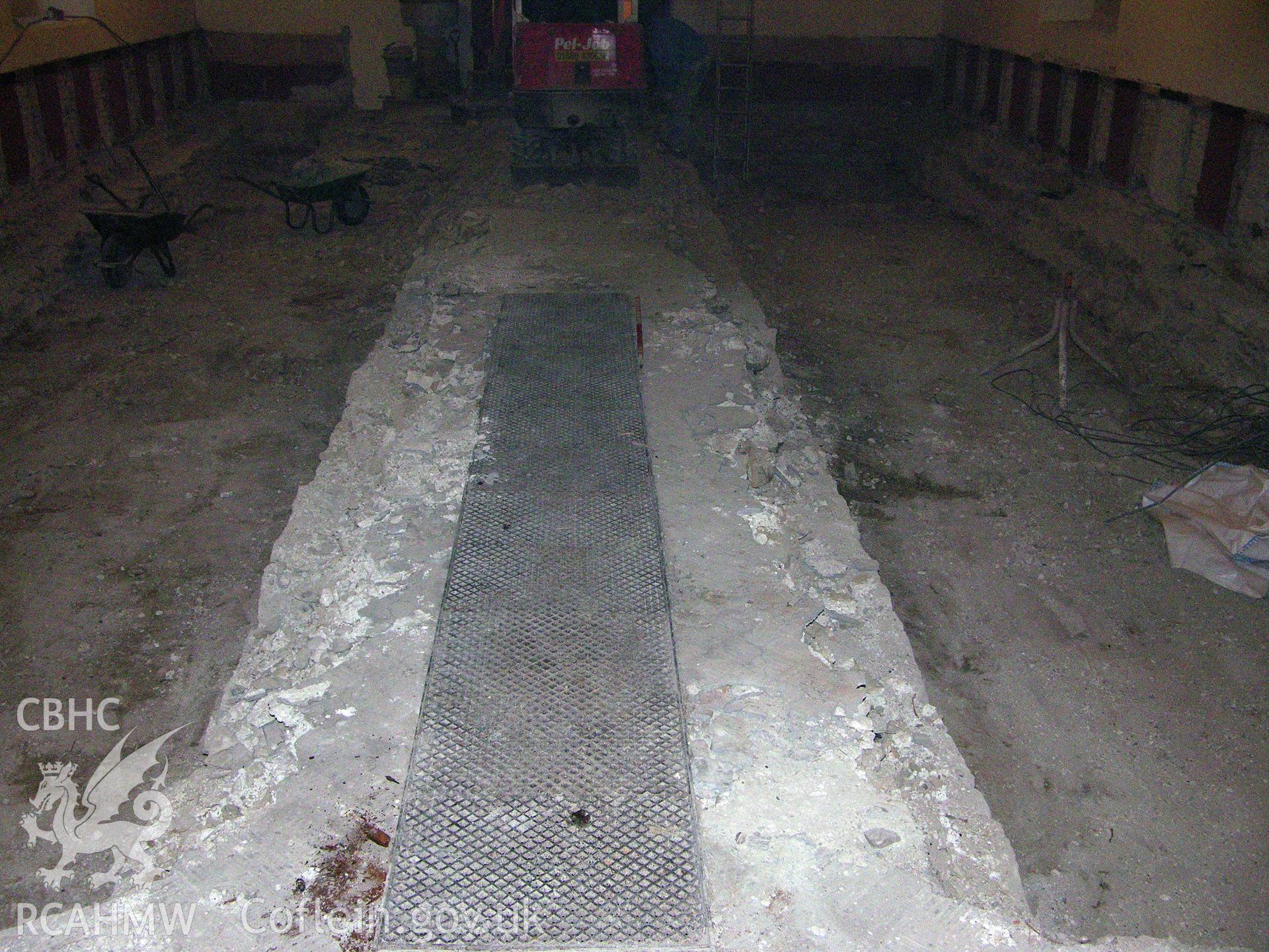 Digital colour photograph showing view of cavities in nave - part of an archaeological watching brief for St Michaels Church, Trefeglwys, Powys (CAP Report 602) by Chris E. Smith.