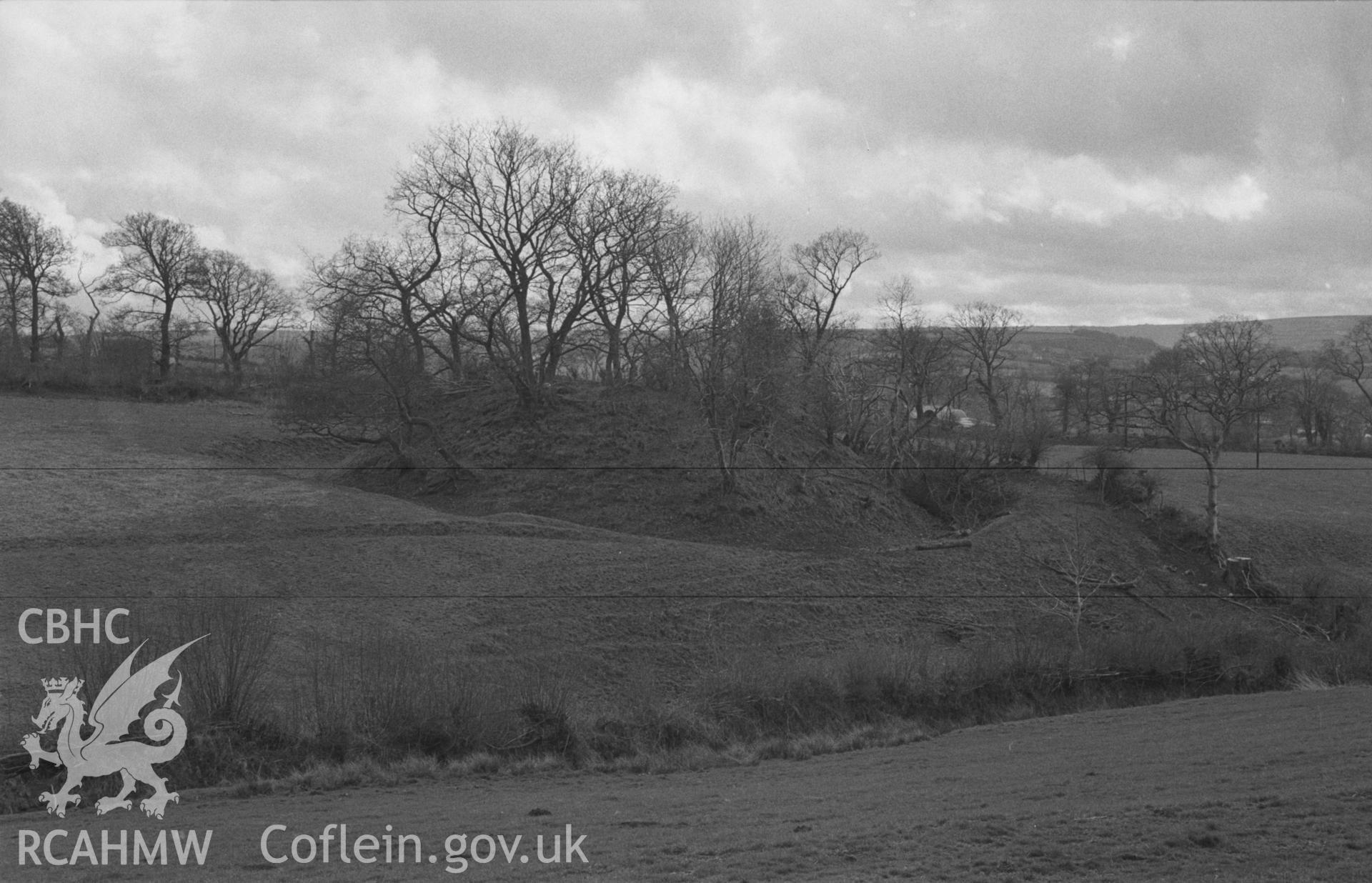 Digital copy of a black and white negative showing Castell Pistog motte, Llandyfriog, Llandysul. Photographed in April 1963 by Arthur O. Chater from Grid Reference SN 3828 4046, looking south south west.