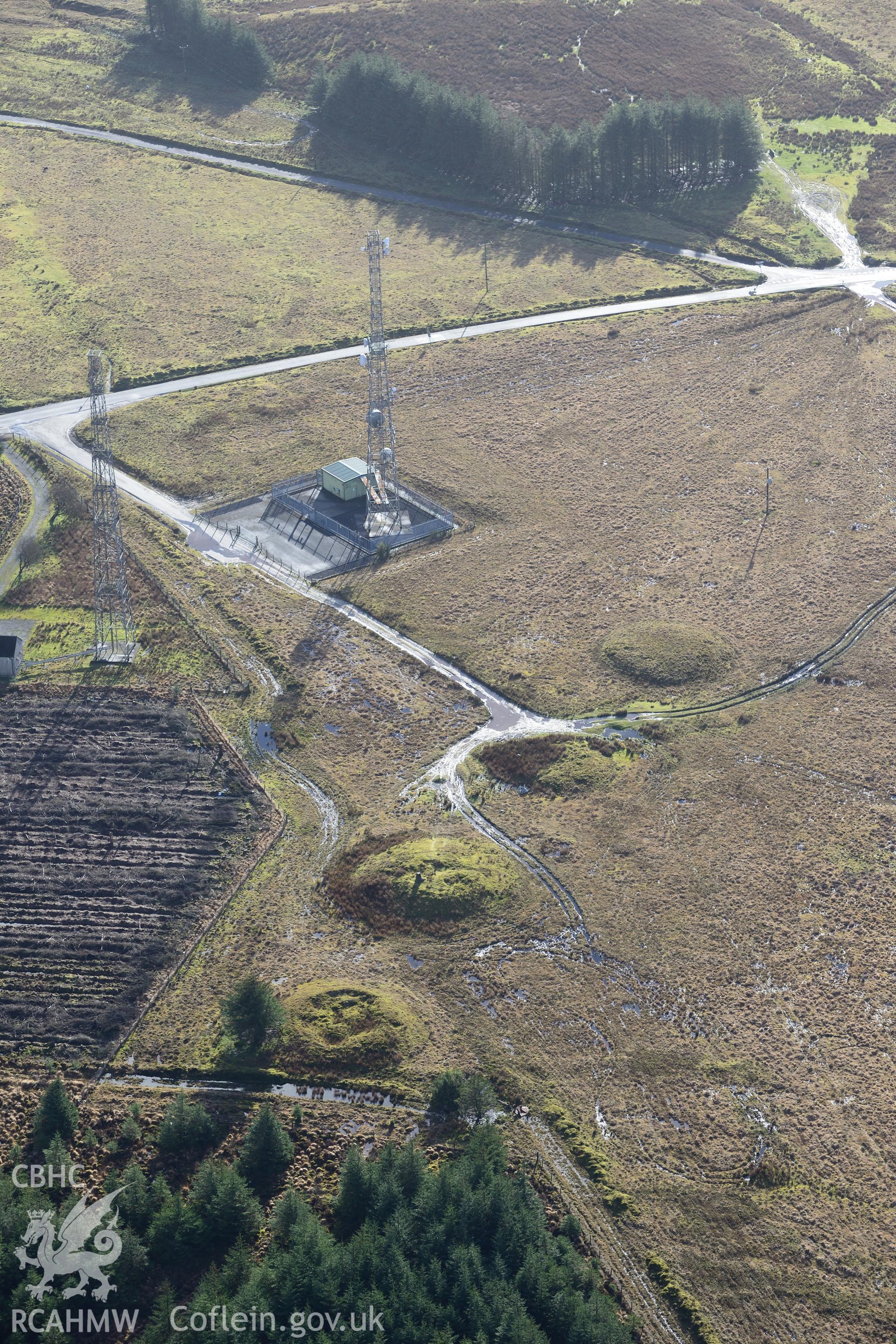 Crugiau Edryd, Cairns I - IV. Oblique aerial photograph taken during the Royal Commission's programme of archaeological aerial reconnaissance by Toby Driver on 6th January 2015.