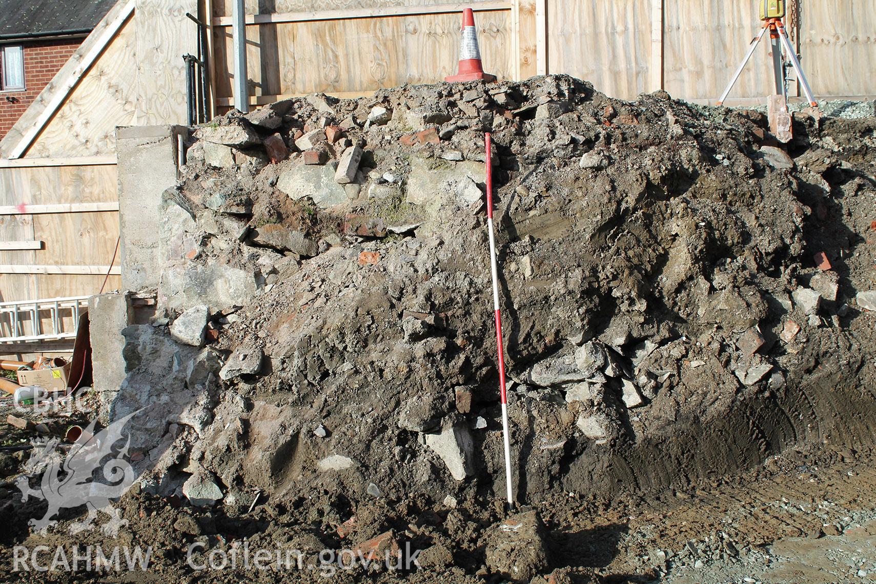 Digital colour photograph showing 'Area B after excavation, looking west.' Photographed during Archaeological Watching Brief conducted at Welshpool Social Club, Bronybuckley, Welshpool, Powys. Prepared by Archaeology Wales, November 2018. Report no. 1723.