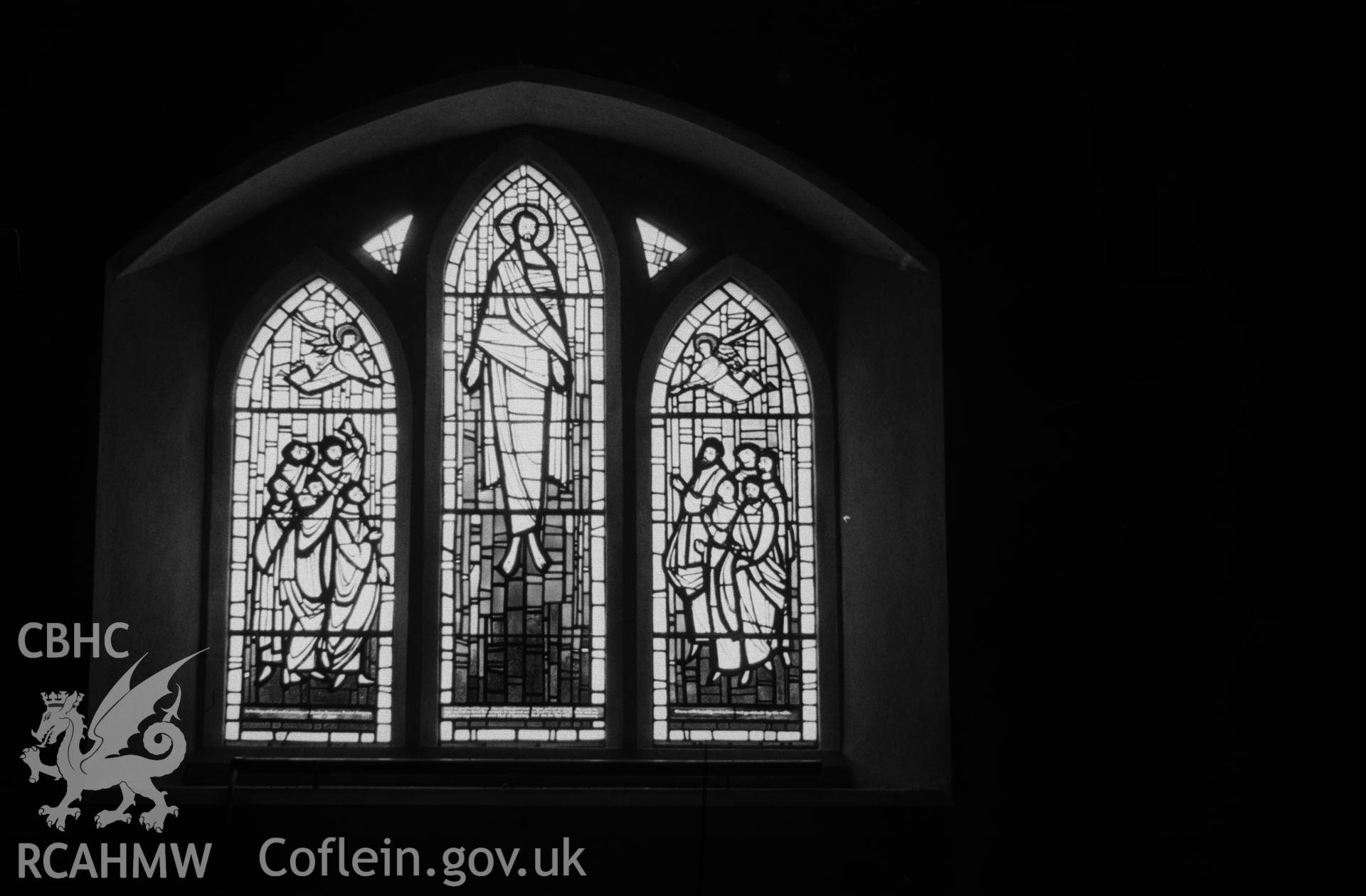 Digital copy of a black and white negative showing stained glass window to Stanley Johnson by Roy Lewis, 1962, in south wall of nave at St. Michael's church, Llandre. Photographed in April 1963 by Arthur O. Chater.