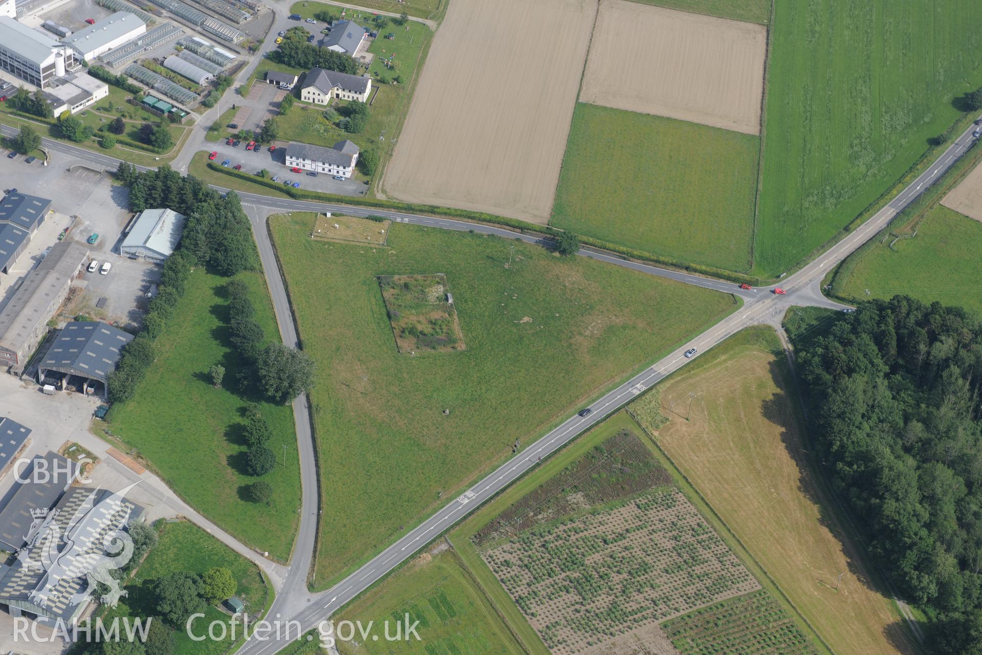 Plas Gogerddan Barrow and excavated features at Plas Gogerddan, south of Bow Street, Aberystwyth. Oblique aerial photograph taken during the Royal Commission?s programme of archaeological aerial reconnaissance by Toby Driver on 12th July 2013.