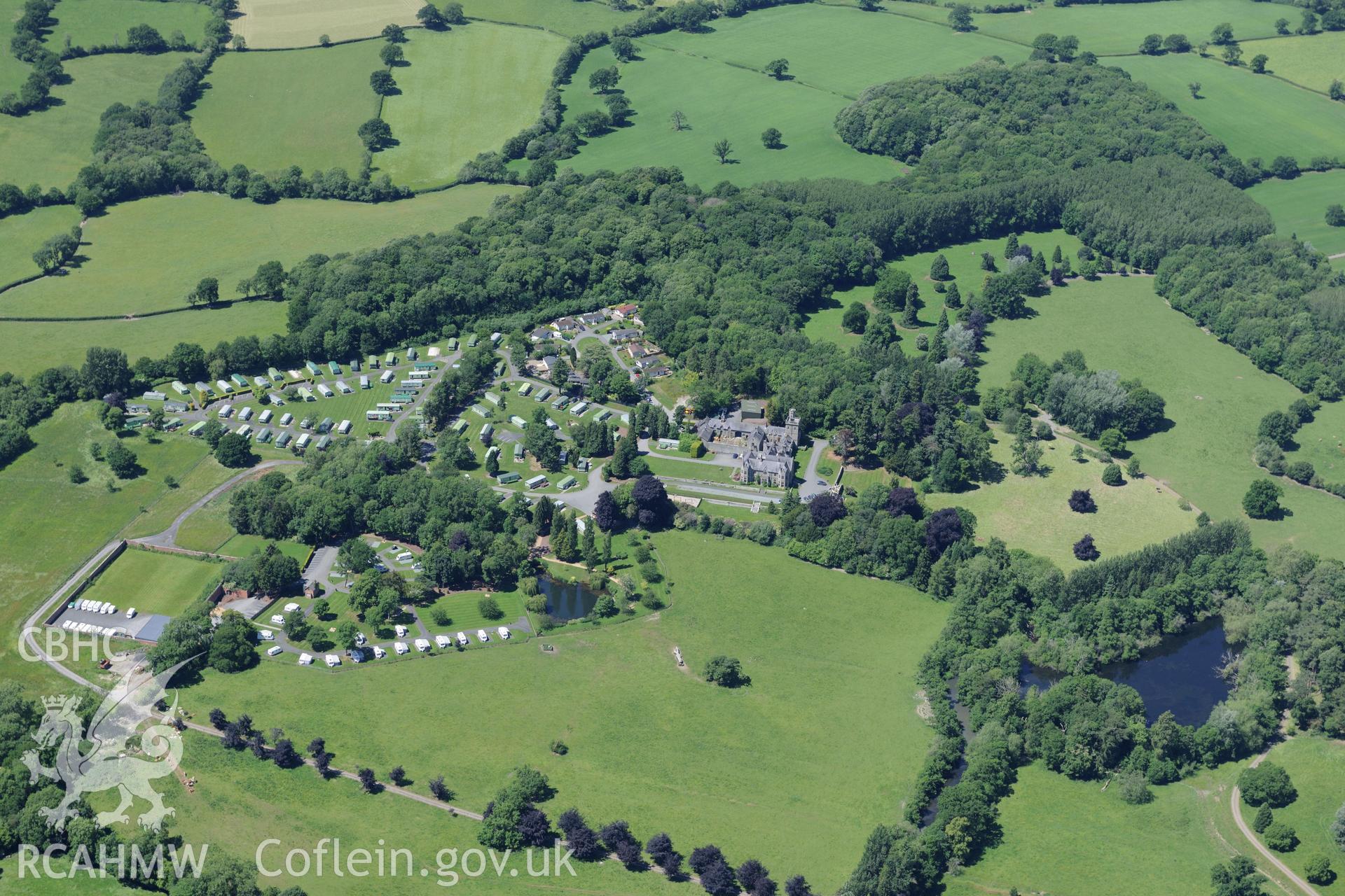 Mellington Hall, it's garden and the section of Offa's Dyke that runs through its grounds. Oblique aerial photograph taken during the Royal Commission's programme of archaeological aerial reconnaissance by Toby Driver on 30th June 2015.