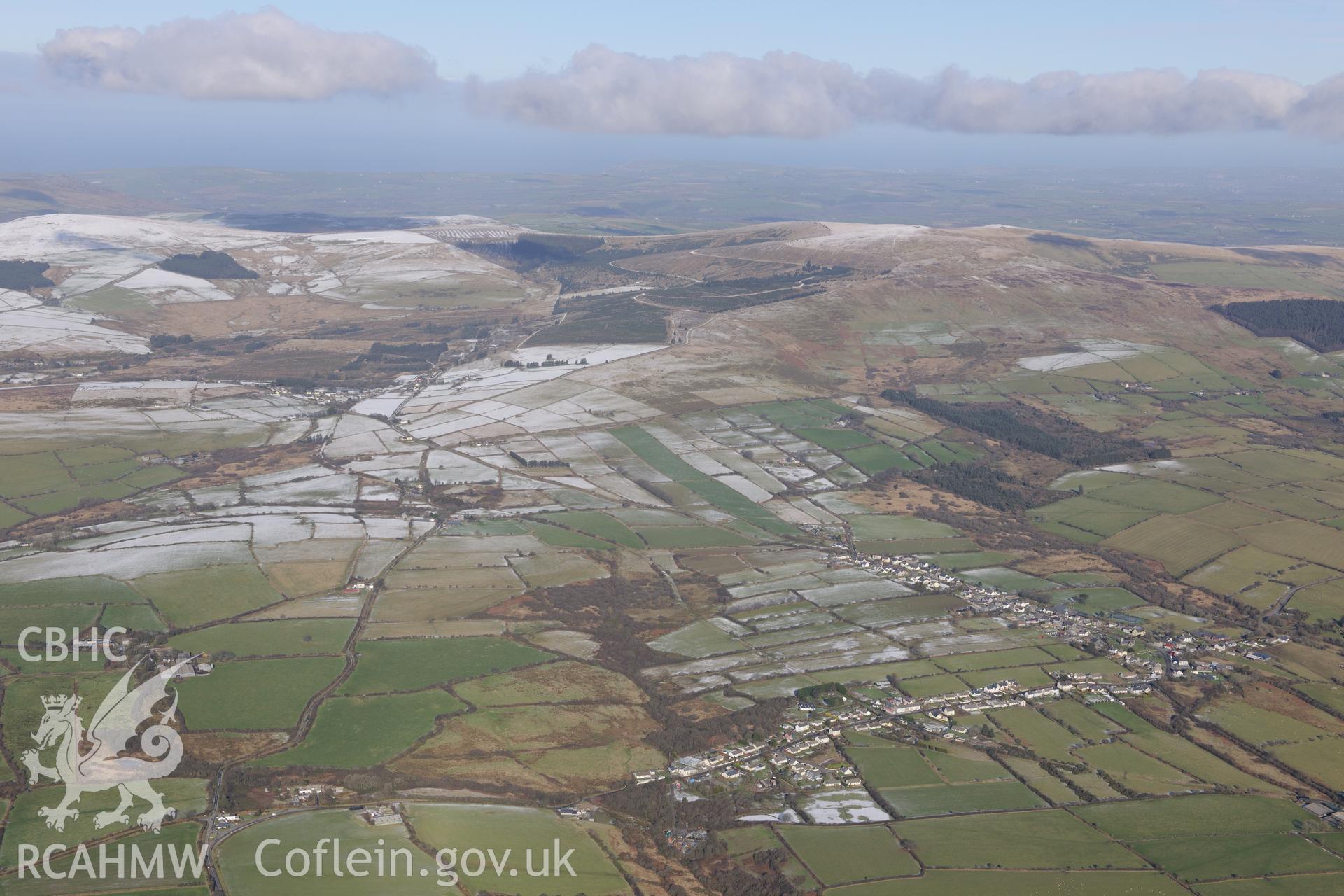 View of the village of Maenclochog from the south. Oblique aerial photograph taken during the Royal Commission's programme of archaeological aerial reconnaissance by Toby Driver on 4th February 2015.