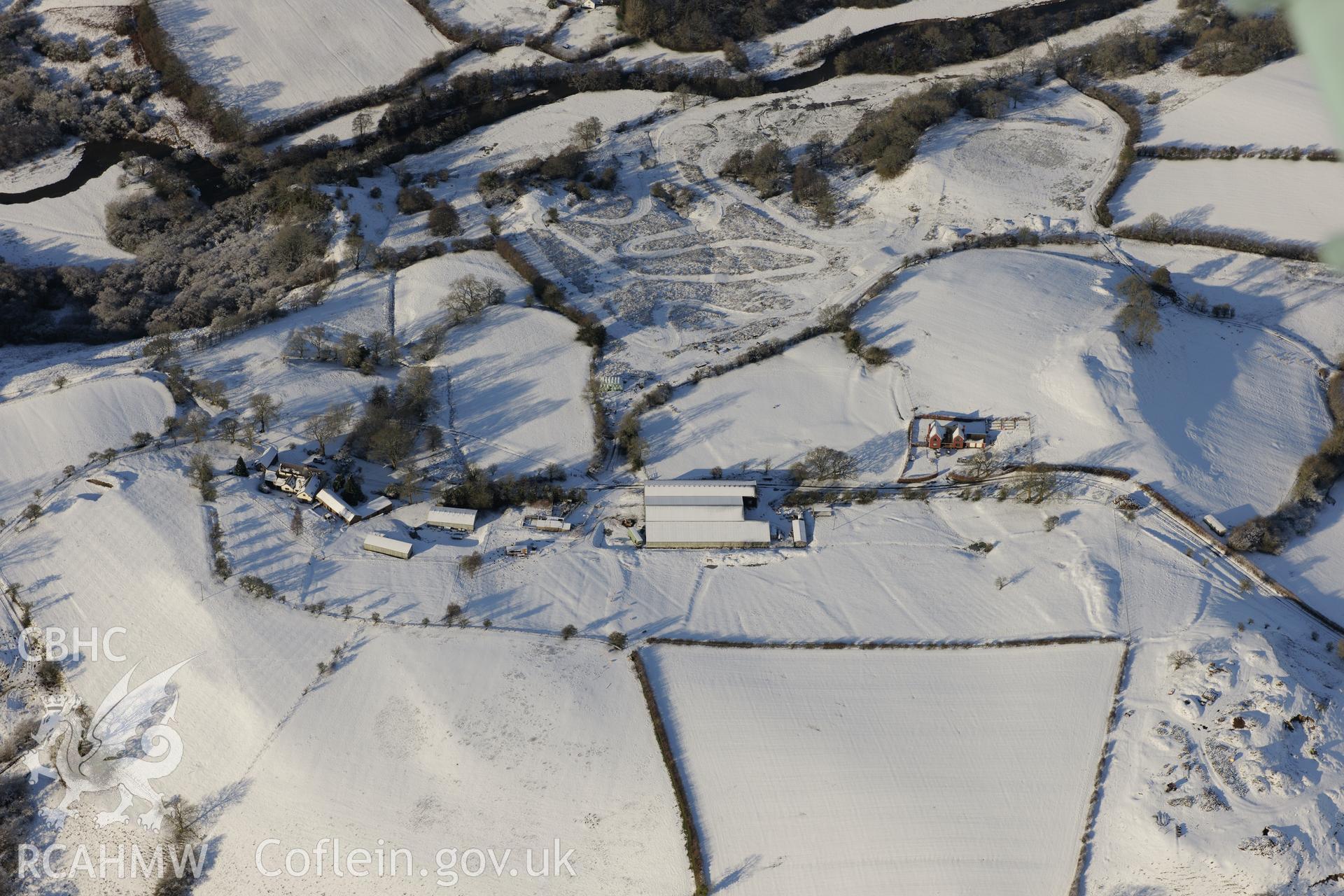 Earthworks of a longhouse and Cefnllys Castle deer park, Penybont, north east of Llandrindod Wells. Oblique aerial photograph taken during the Royal Commission?s programme of archaeological aerial reconnaissance by Toby Driver on 15th January 2013.