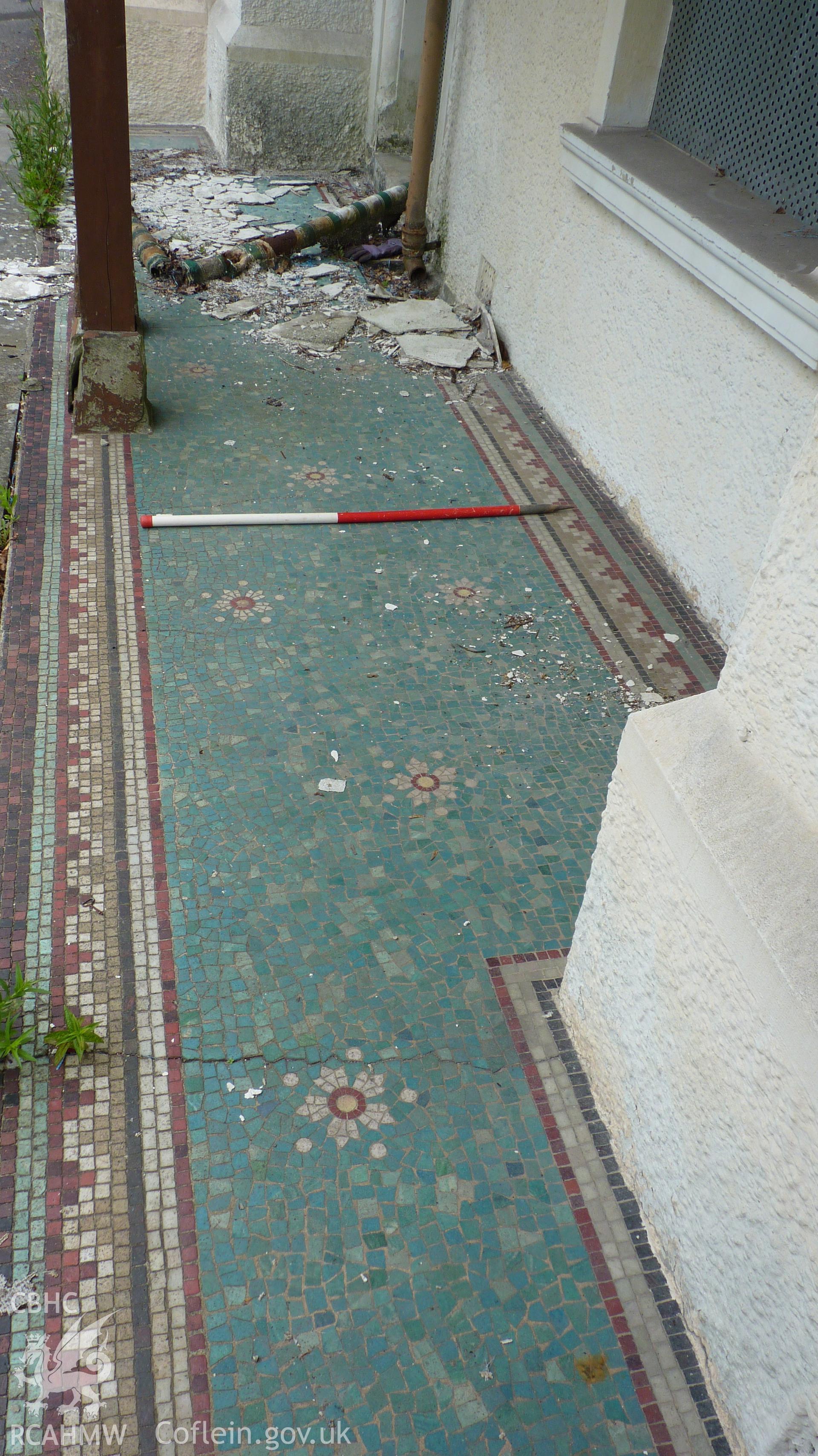 'Mosaic tiling in front of Coed Parc. 1m scale.' Photographed as part of archaeological work at Coed Parc, Newcastle, Bridgend, carried out by Archaeology Wales, 2016. Project no. P2432.