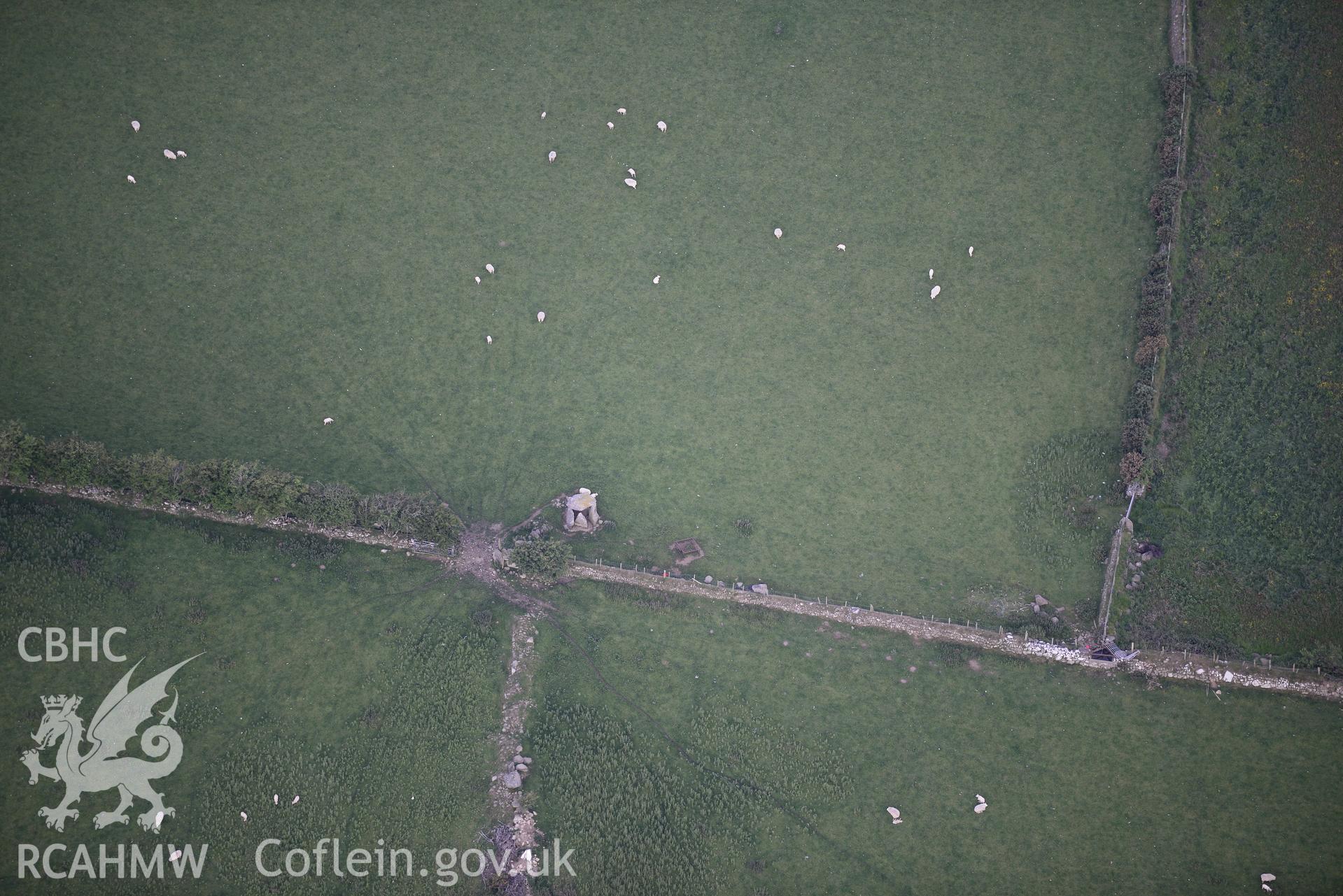 Burial chamber on Cromlech farm near Y Ffor. Oblique aerial photograph taken during the Royal Commission's programme of archaeological aerial reconnaissance by Toby Driver on 23rd June 2015.