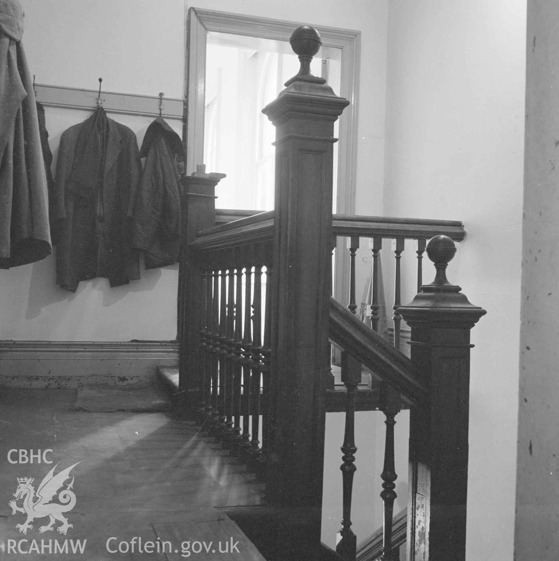 Digital copy of a black and white negative showing interior view of staircase on upper level of Llanidloes Railway Station taken by D B Hague.