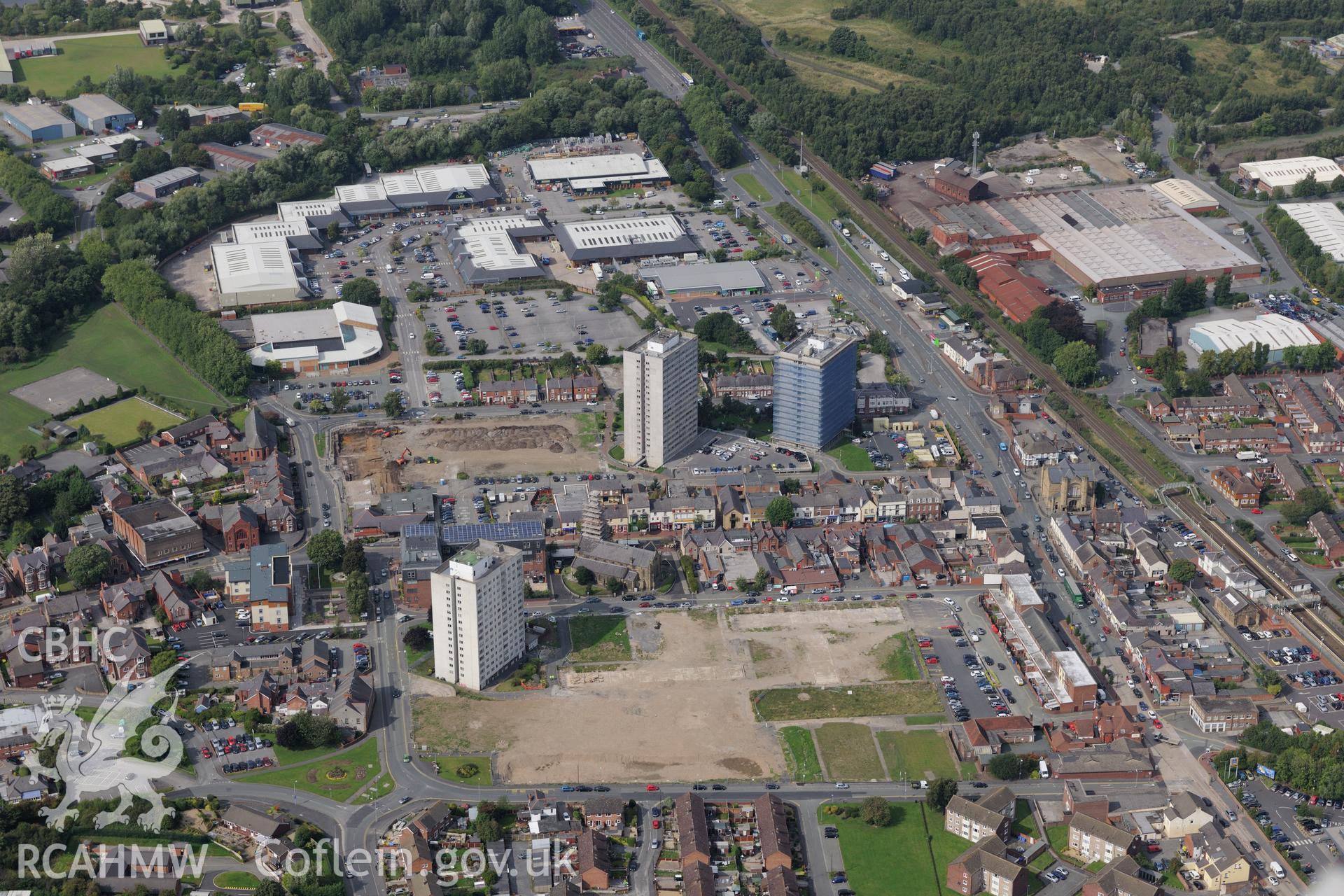 Ashmount Centre (formerly alkali works, then textile factory) & former housing estate, now retail centre, Flint. Oblique aerial photograph taken during Royal Commission's programme of archaeological aerial reconnaissance by Toby Driver on 11/9/2015.