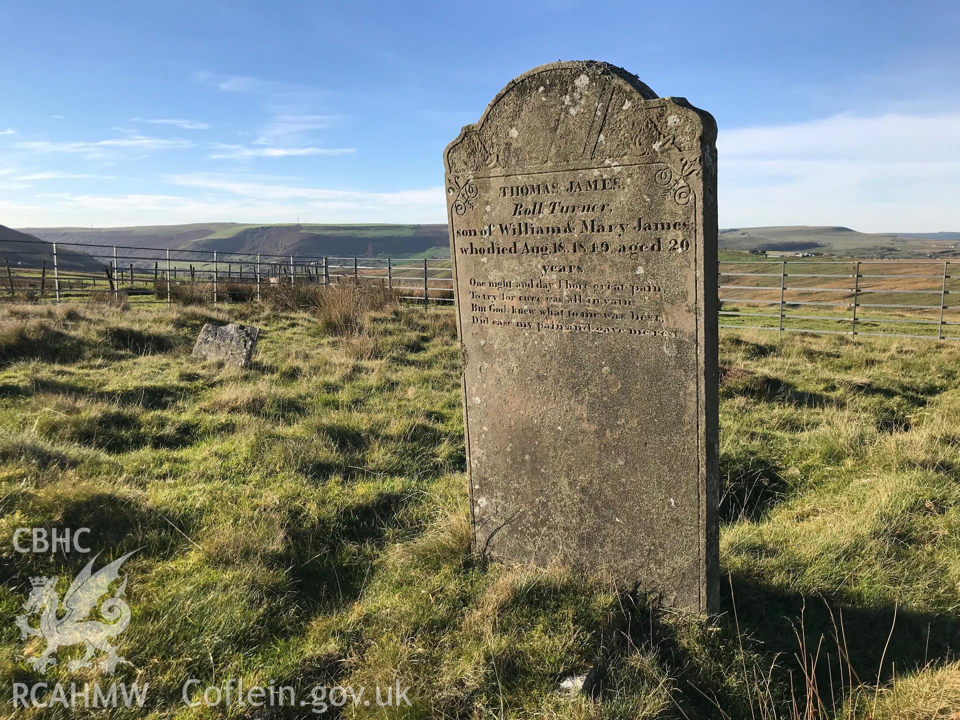 Detailed view of Thomas James' gravestone at the Tredegar Ironworks cholera cemetery. Colour photograph taken by Paul R. Davis on 24th October 2018. Transcript: THOMAS JAMES, ROLL TURNER, son of William & Mary James who died Aug. 18. 1849, aged 20 years.