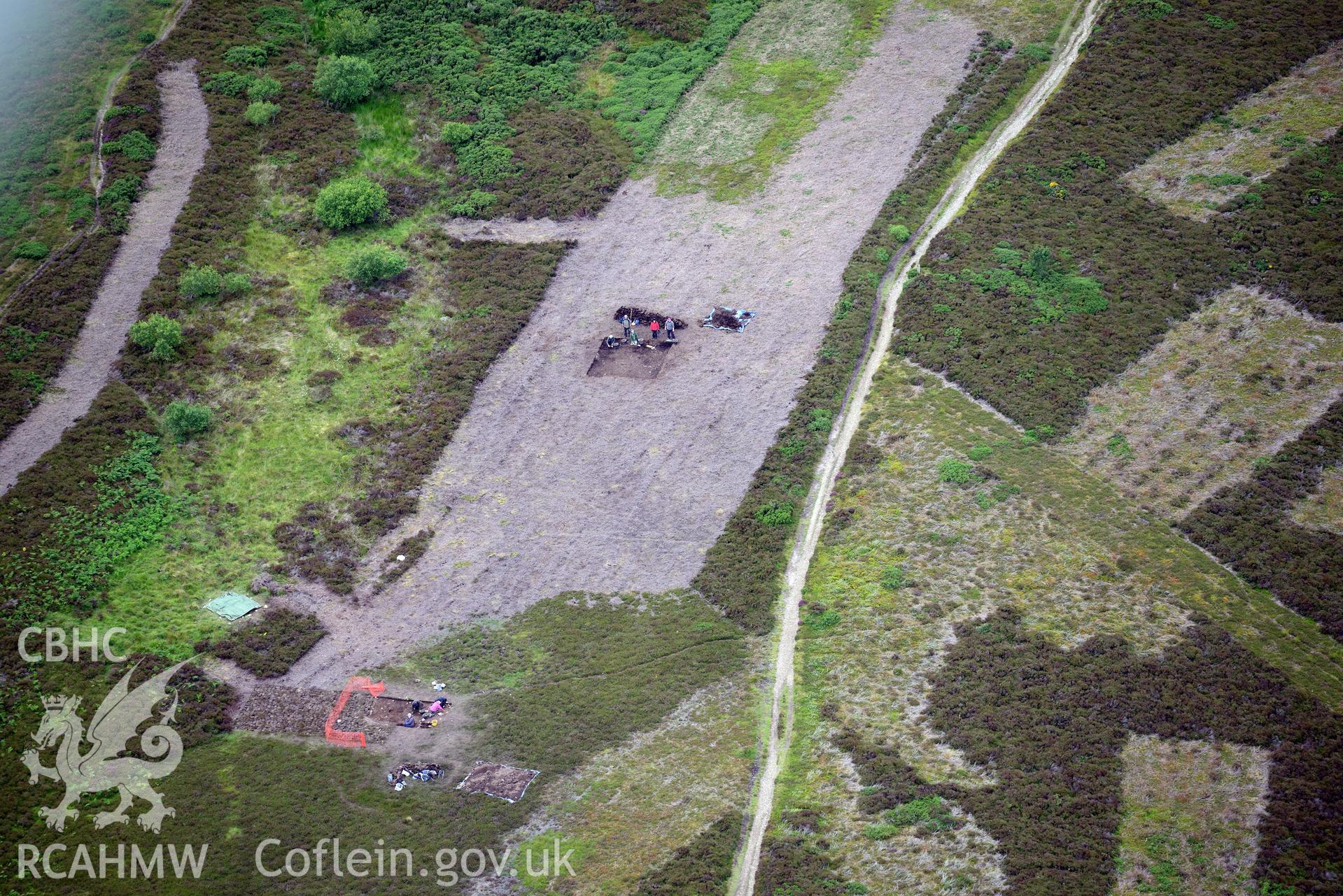 Moel Arthur Hillfort. Excavation by Liverpool University. Oblique aerial photograph taken during the Royal Commission's programme of archaeological aerial reconnaissance by Toby Driver on 30th July 2015.