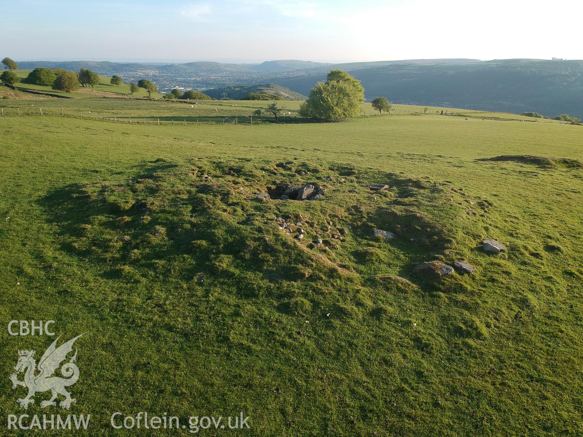 Digital colour photograph showing view of Mynydd Bach cairn or round barrow, Maesycwmmer, taken by Paul R. Davis on 13th May 2019.