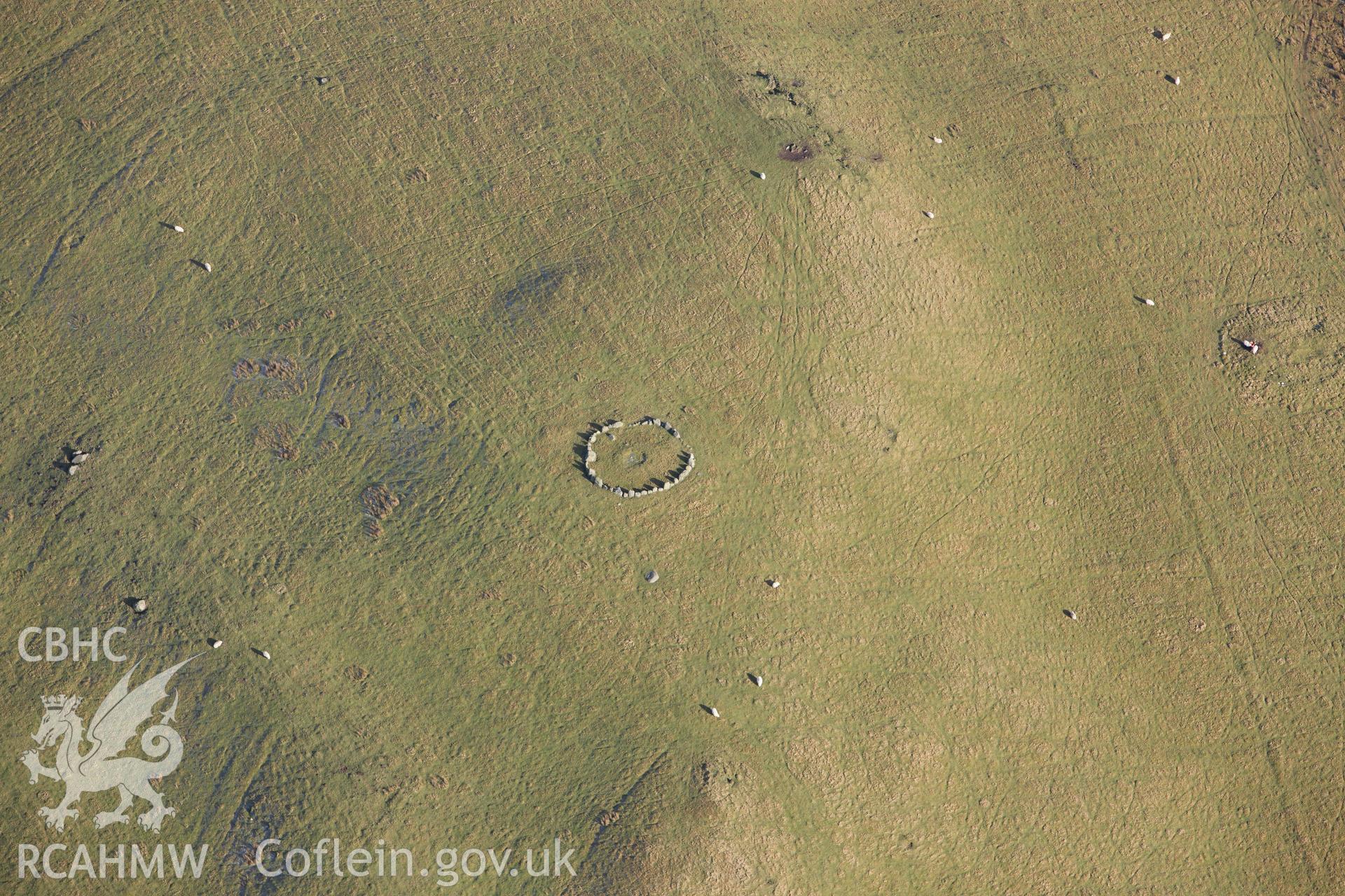 RCAHMW colour oblique photograph of Moel Ty-Uchaf ring cairn. Taken by Toby Driver on 08/02/2011.