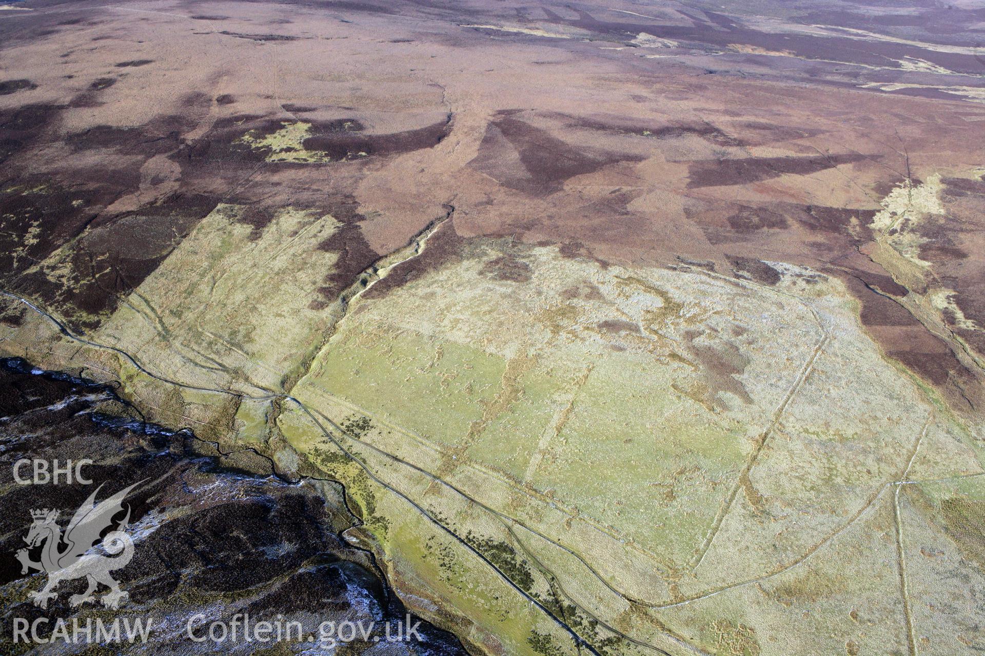 RCAHMW colour oblique photograph of Pen Plaenau roman marching camp. Taken by Toby Driver on 08/02/2011.