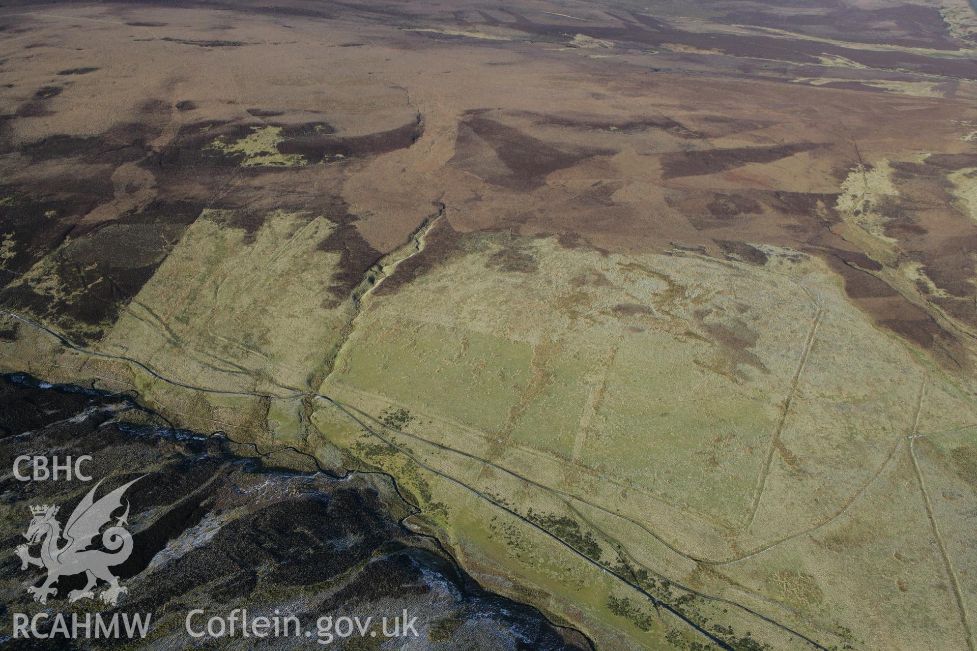 RCAHMW colour oblique photograph of Pen Plaenau roman marching camp. Taken by Toby Driver on 08/02/2011.