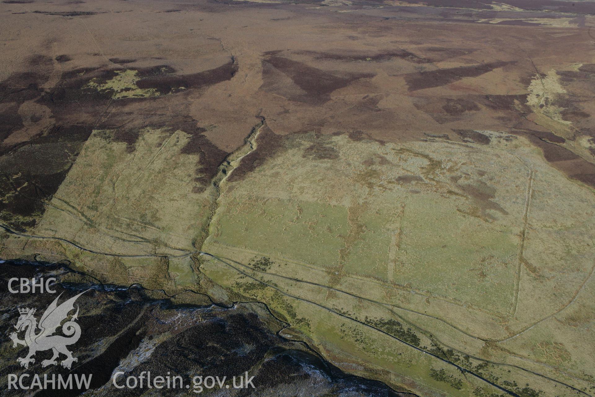 RCAHMW colour oblique photograph of Pen Plaenau roman marching camp. Taken by Toby Driver on 08/02/2011.