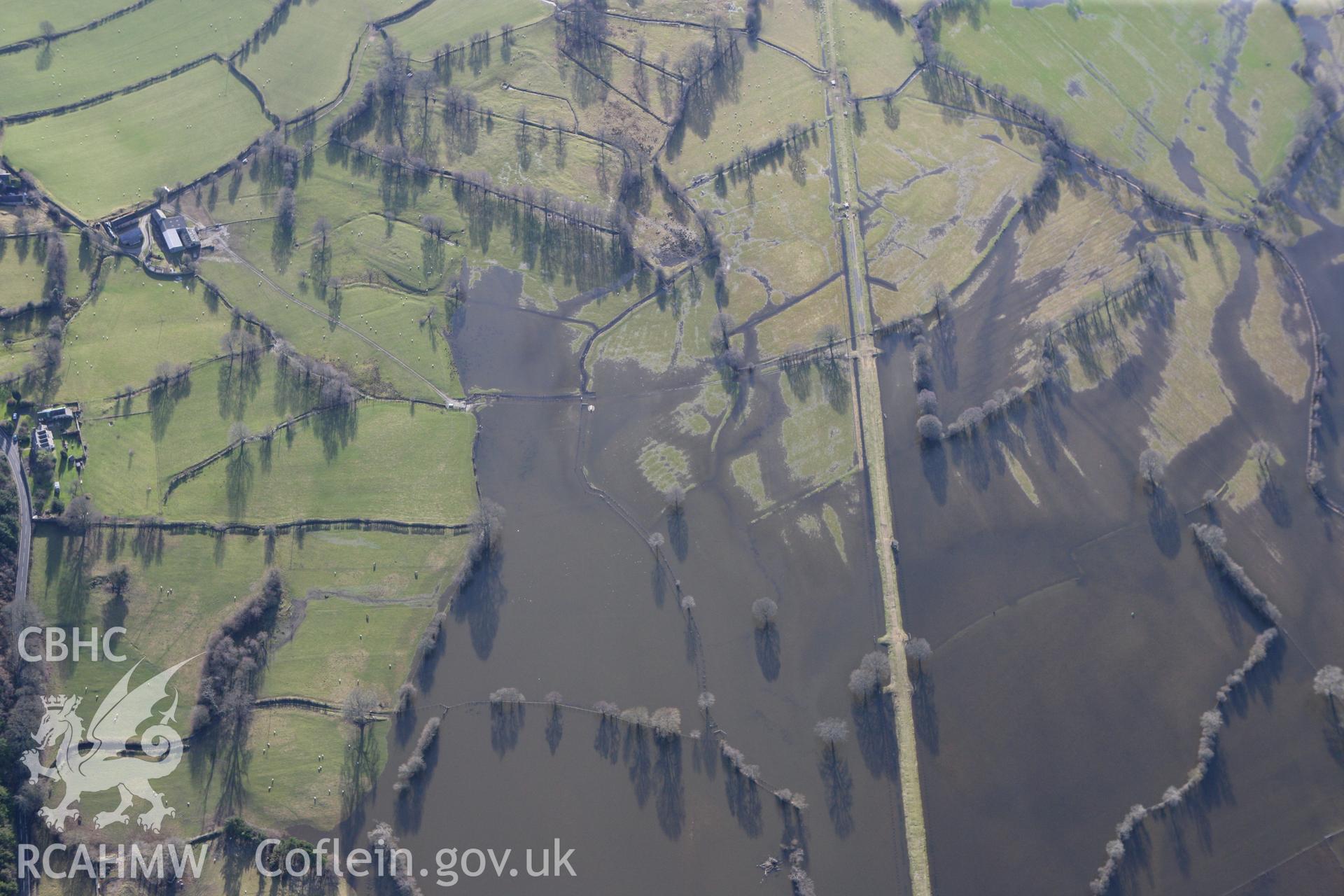 RCAHMW colour oblique photograph of Afon Dyfrdwy in flood, to the west of Tan-y-Coed chambered tomb. Taken by Toby Driver on 08/02/2011.