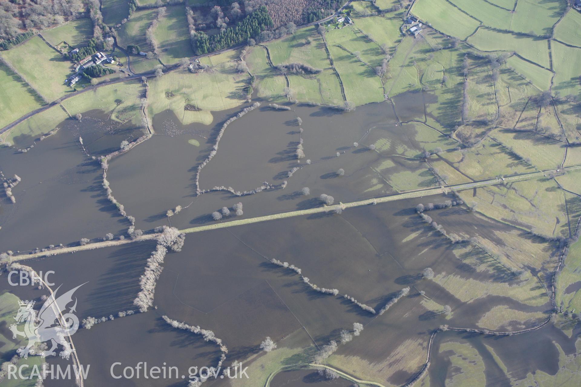 RCAHMW colour oblique photograph of Afon Dyfrdwy in flood, to the west of Tan-y-Coed chambered tomb. Taken by Toby Driver on 08/02/2011.