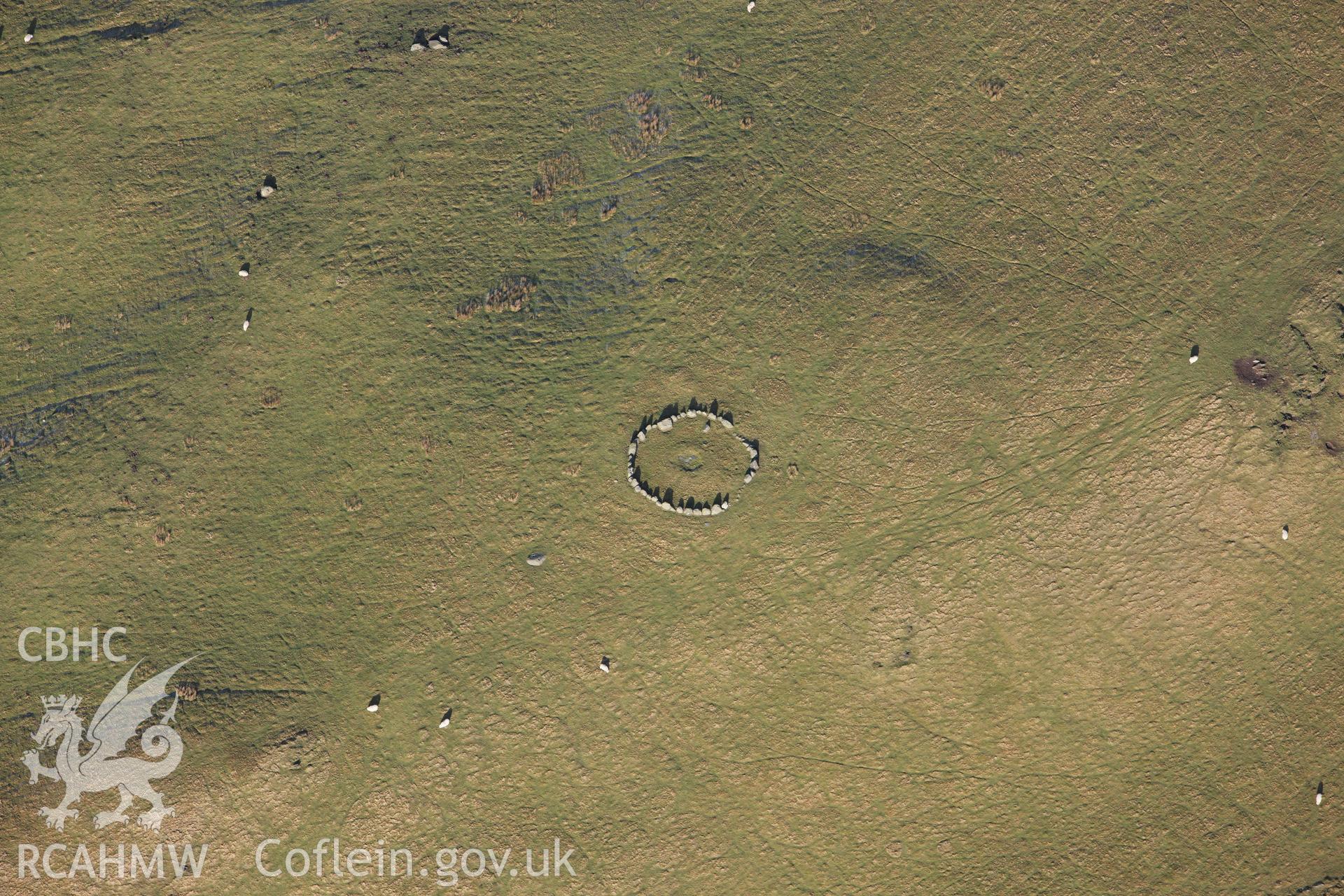 RCAHMW colour oblique photograph of Moel Ty-Uchaf ring cairn. Taken by Toby Driver on 08/02/2011.