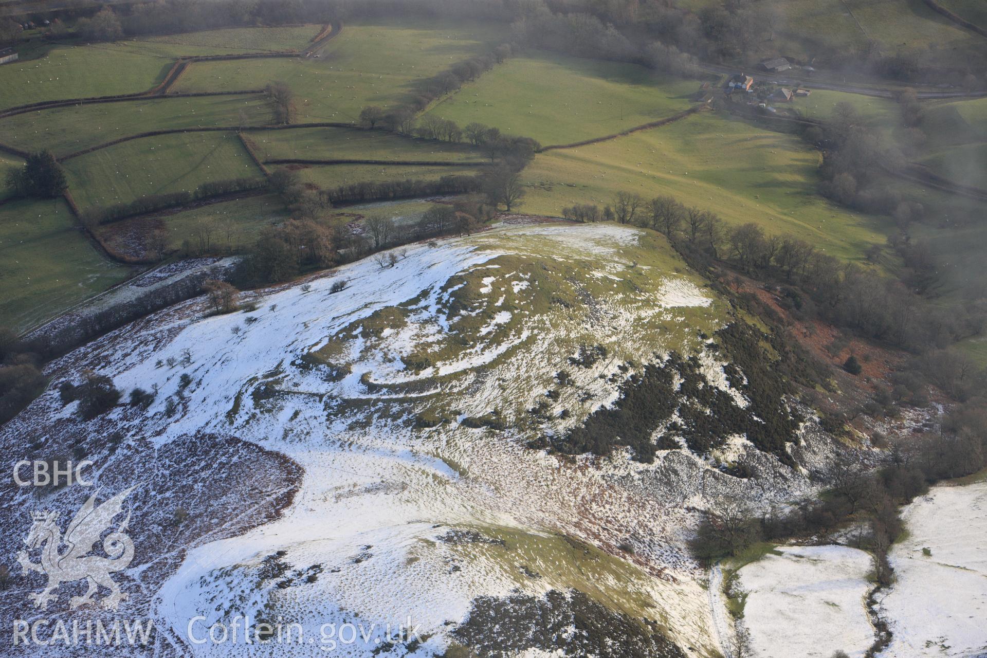 RCAHMW colour oblique photograph of Caer Einion hillfort, with melting snow. Taken by Toby Driver on 18/12/2011.