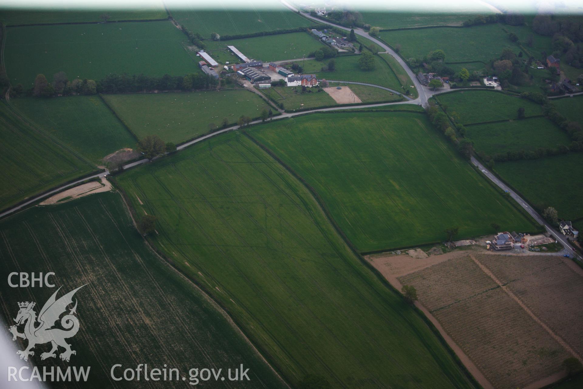 RCAHMW colour oblique photograph of Brompton or Pentrehyling Roman marching camps. Taken by Toby Driver on 26/04/2011.