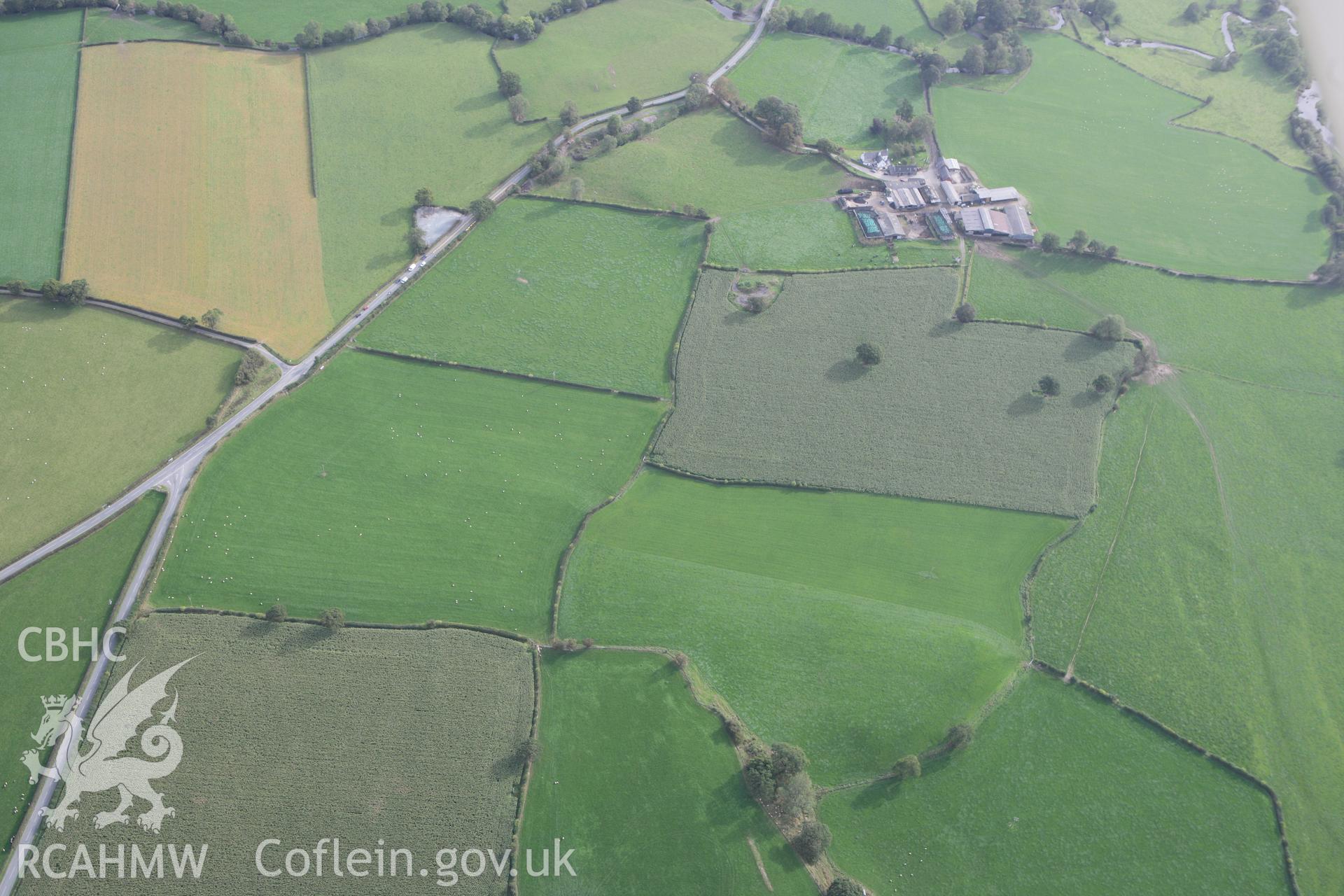 RCAHMW colour oblique photograph of Maes Mochnant Isaf, Round Barrow. Taken by Toby Driver on 04/10/2011.