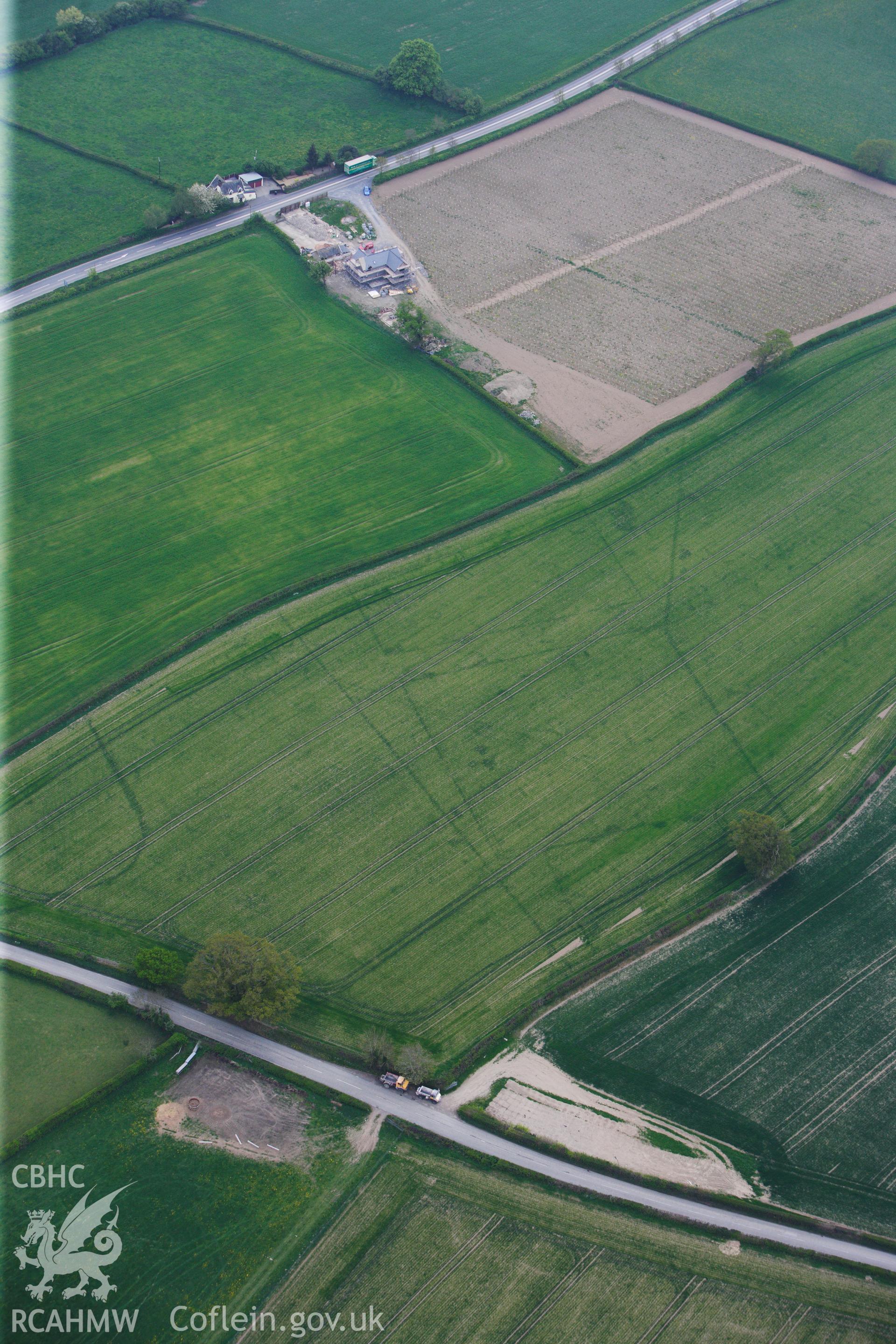 RCAHMW colour oblique photograph of Brompton or Pentrehyling Roman marching camps. Taken by Toby Driver on 26/04/2011.